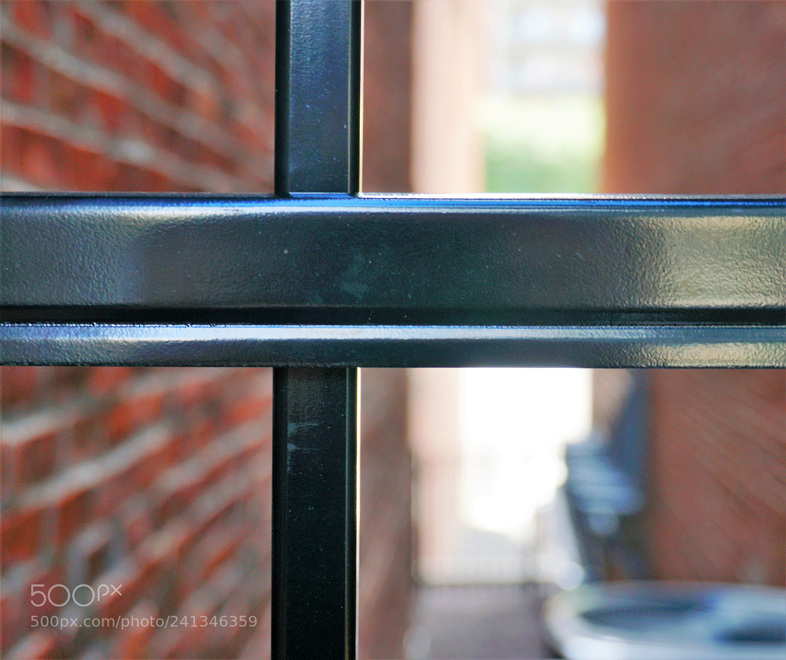 Sony a6500 sample photo. Metal gate to alley photography