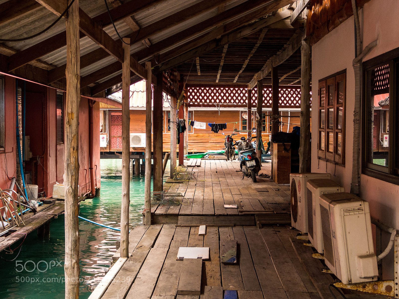 Olympus OM-D E-M10 sample photo. Stilt houses in ban photography