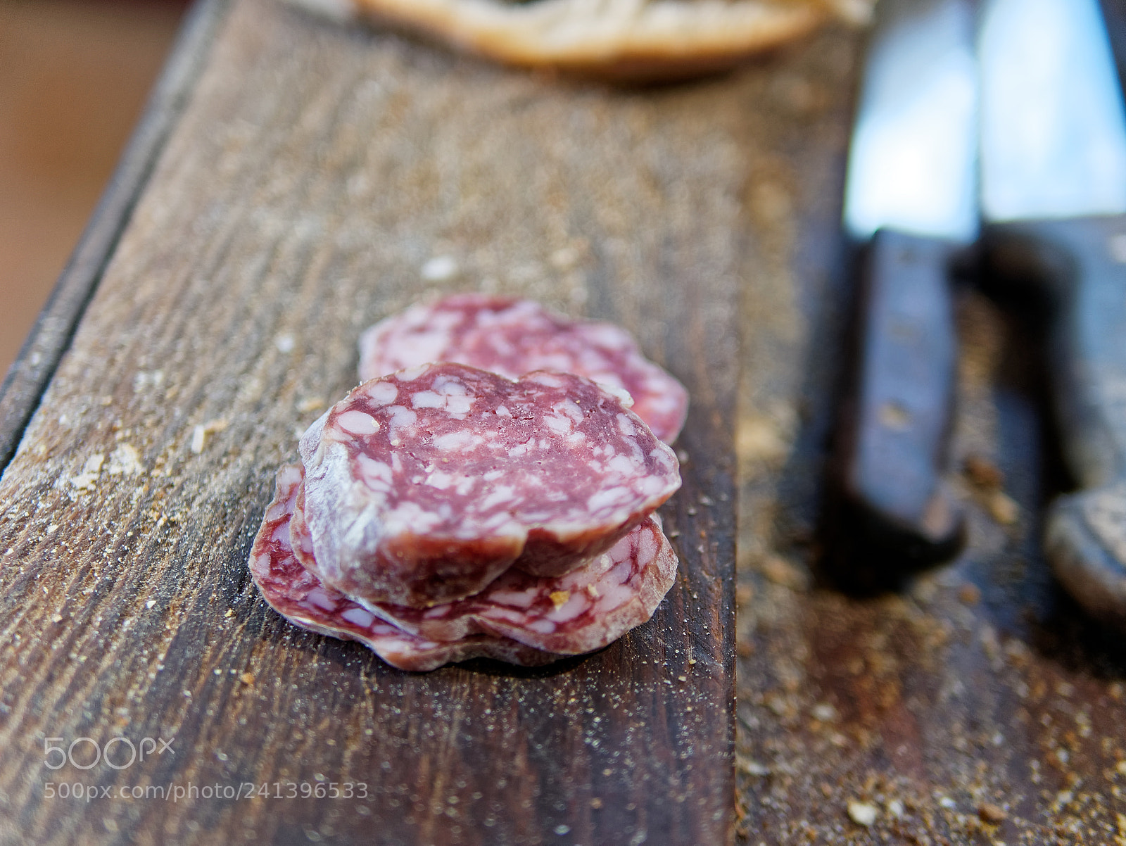 Panasonic Lumix DMC-GX85 (Lumix DMC-GX80 / Lumix DMC-GX7 Mark II) sample photo. Sliced salami on cutting photography
