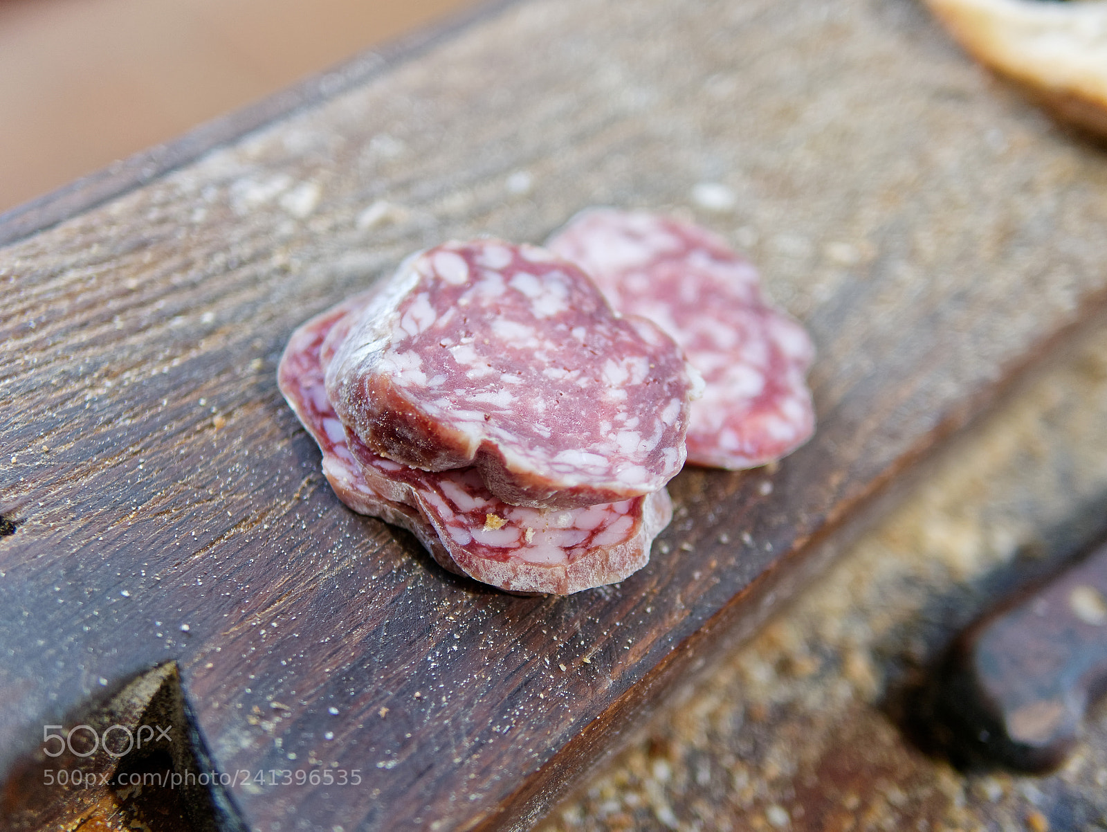 Panasonic Lumix DMC-GX85 (Lumix DMC-GX80 / Lumix DMC-GX7 Mark II) sample photo. Sliced salami on cutting photography