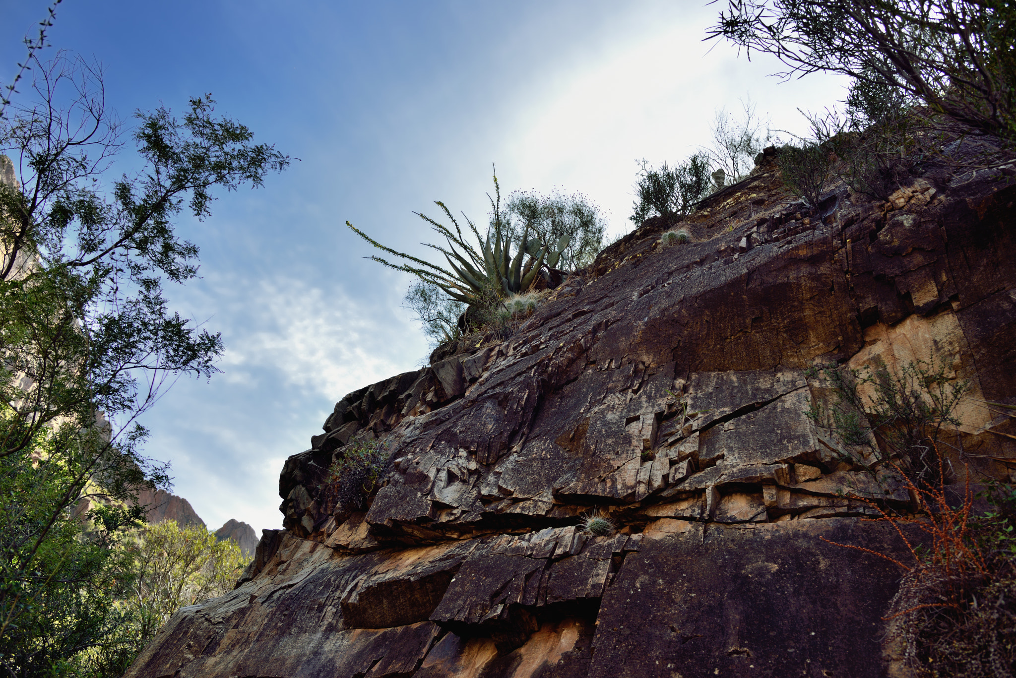 Nikon AF-S Nikkor 24-120mm F4G ED VR sample photo. Nearby walls of mountainside with skies and clouds above photography