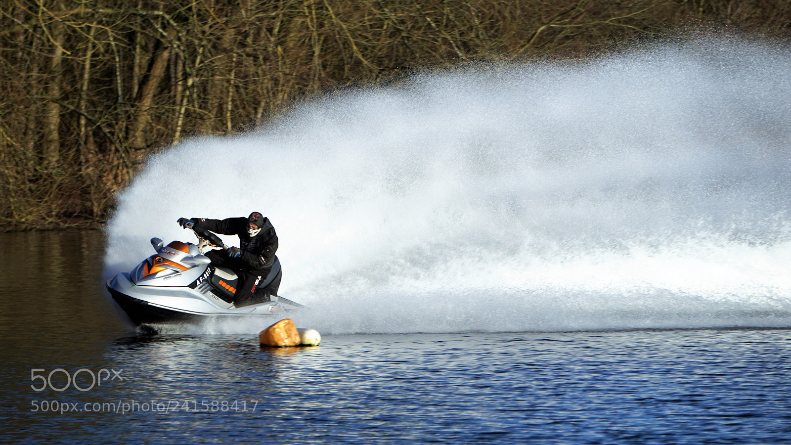 Sony E 55-210mm F4.5-6.3 OSS sample photo. Jet ski rainbow water. photography