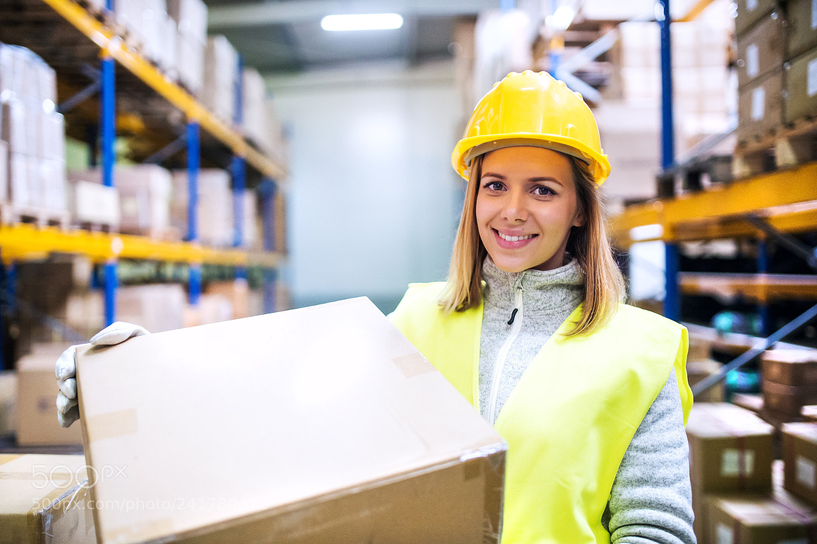 Nikon D4S sample photo. Female warehouse worker loading photography