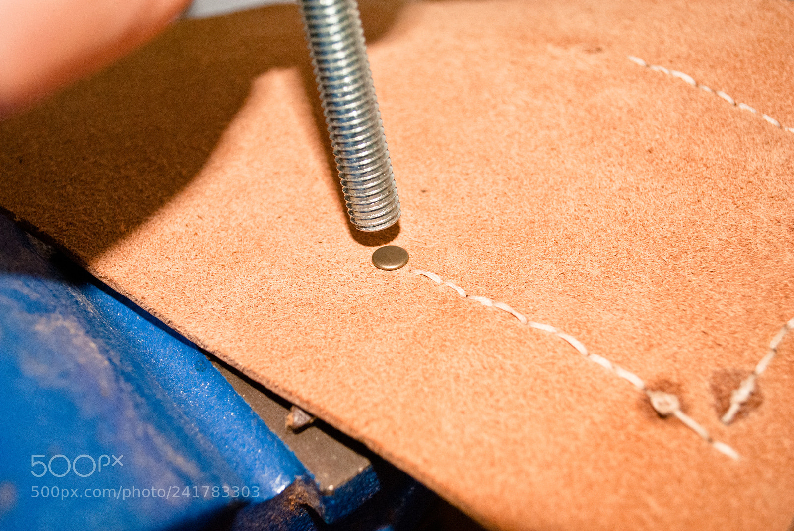 Nikon D3000 sample photo. Dodgy rivet setting photography