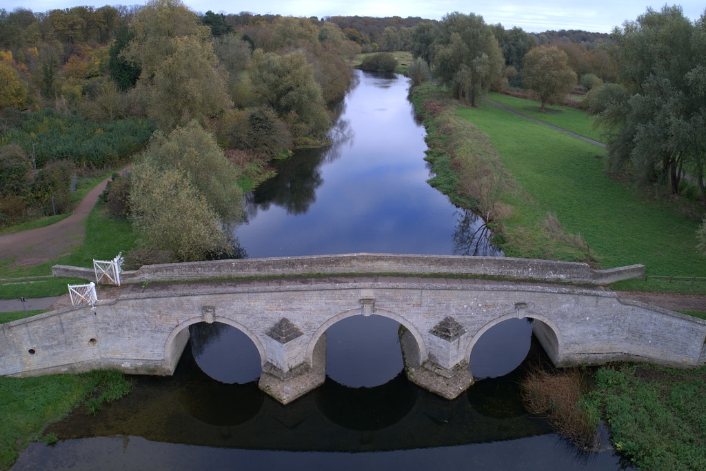 The stone bridge over the river Nene at Ferry Meadows Country Pa by