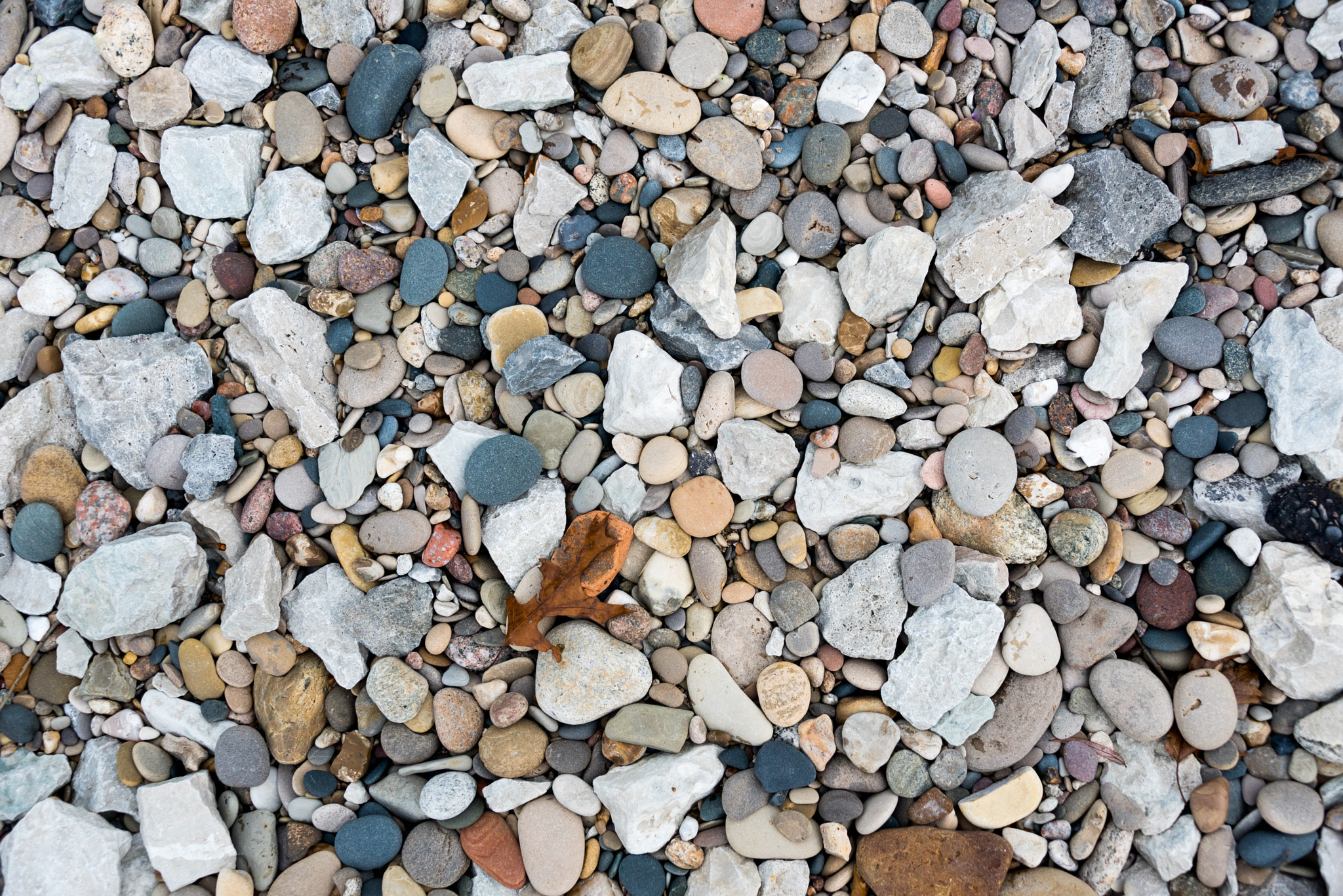 Small rocks on a lake beach - texture