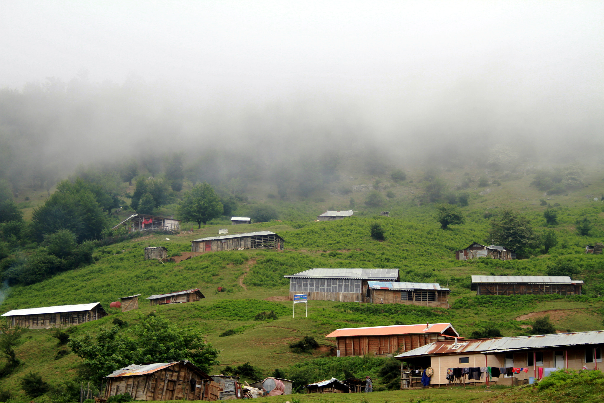 Canon EF-S 18-55mm F3.5-5.6 II sample photo. Fog on village photography