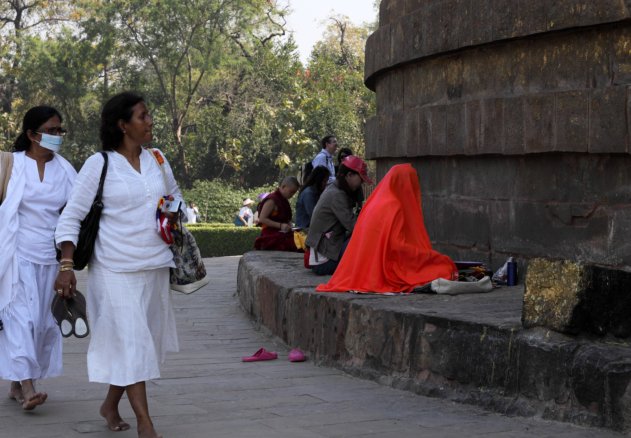 Canon EOS 50D + Canon EF 50mm F1.4 USM sample photo. Img praying at stupa photography