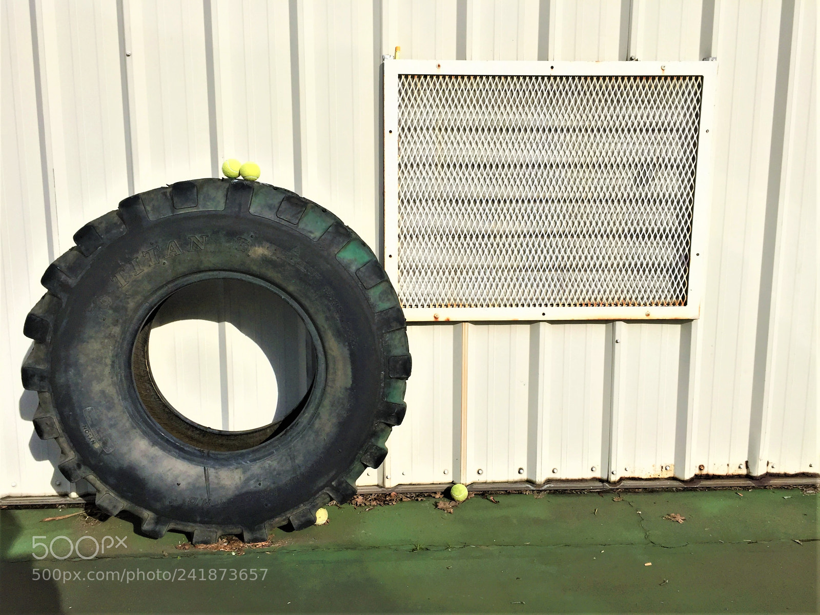 Apple iPhone 6 sample photo. Tennis ball on tire photography