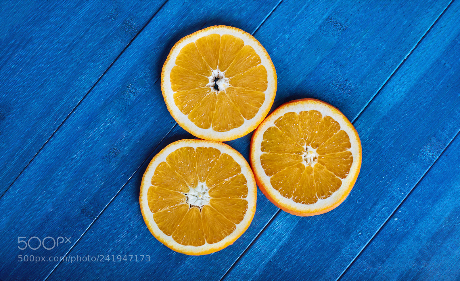 Canon EOS 5DS sample photo. Orange slice on blue photography