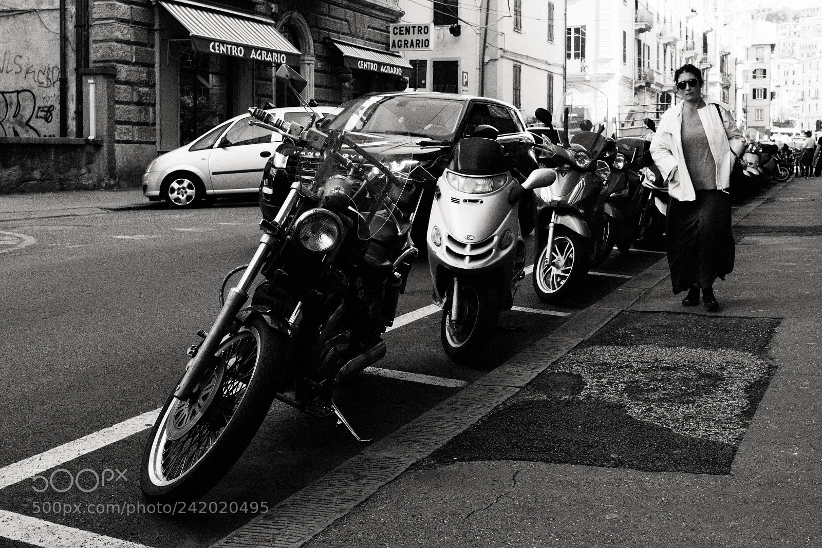 Sony a6500 sample photo. Motorcycles with woman walking photography