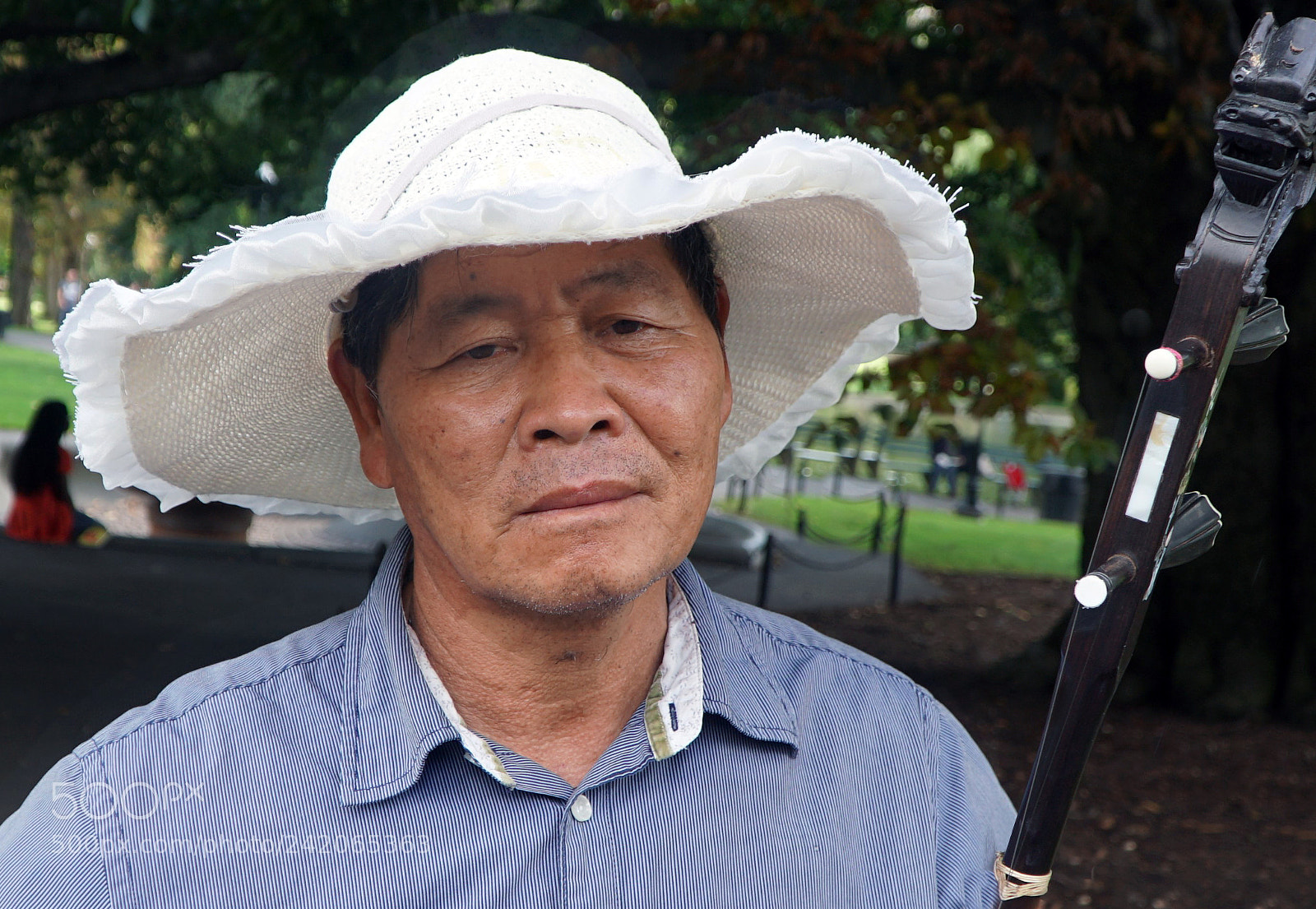 Sony a6500 sample photo. A sad street performer photography