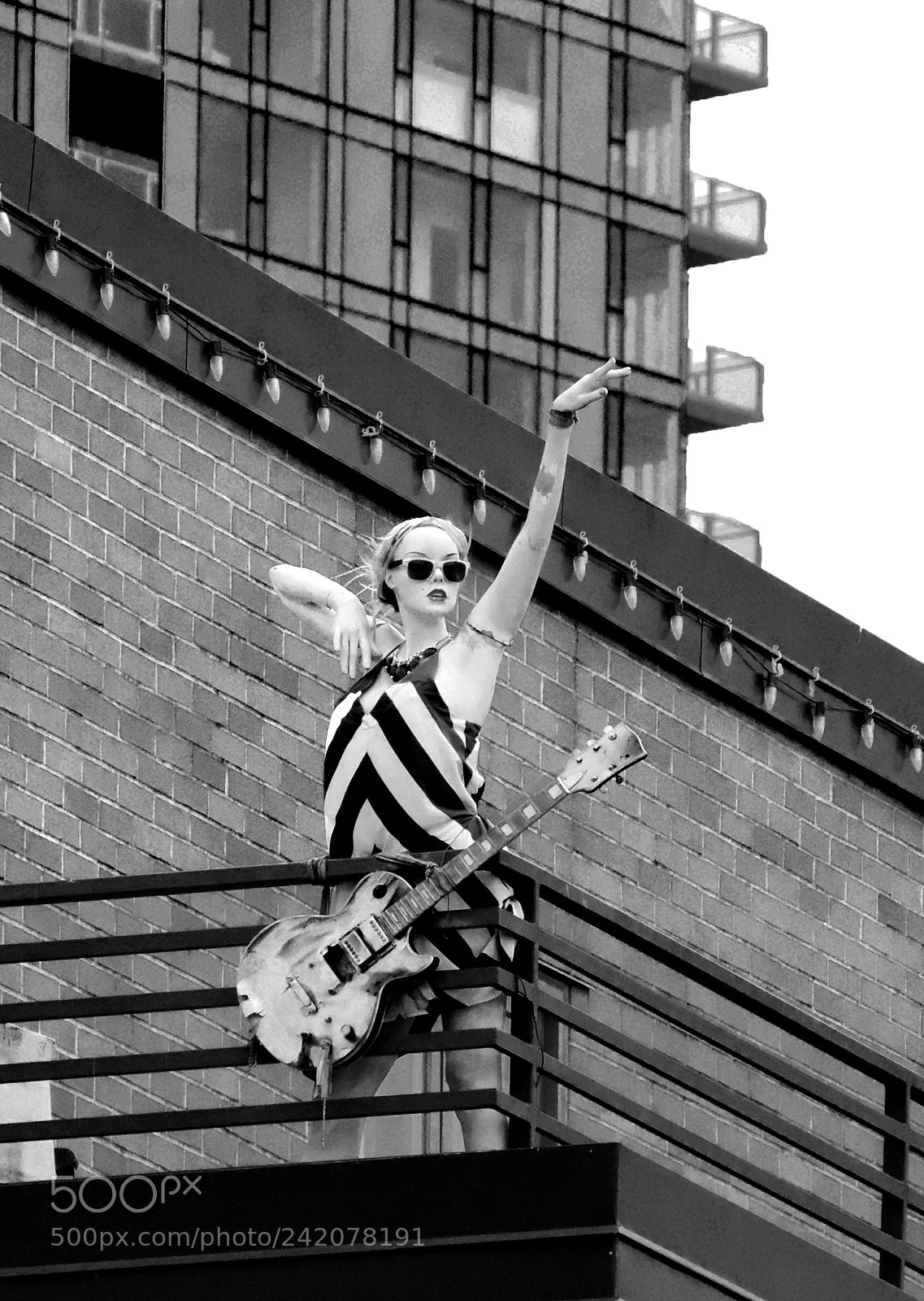 Nikon Coolpix P520 sample photo. Manikin with guitar on photography