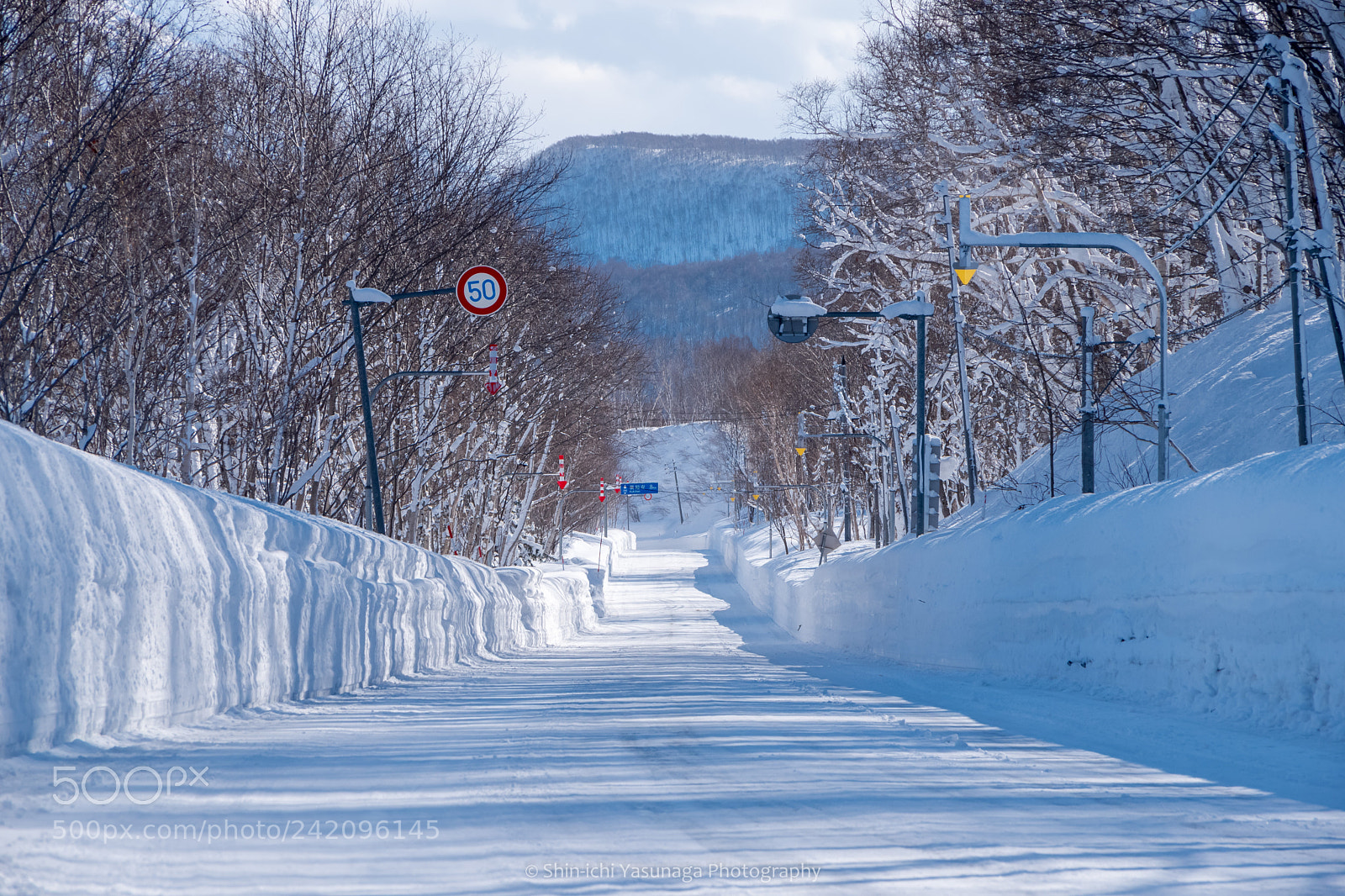 Pentax K-70 sample photo. Winter straight road photography