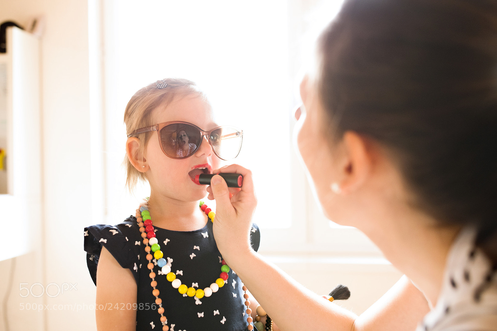 Nikon D5 sample photo. Mother painting lips of photography