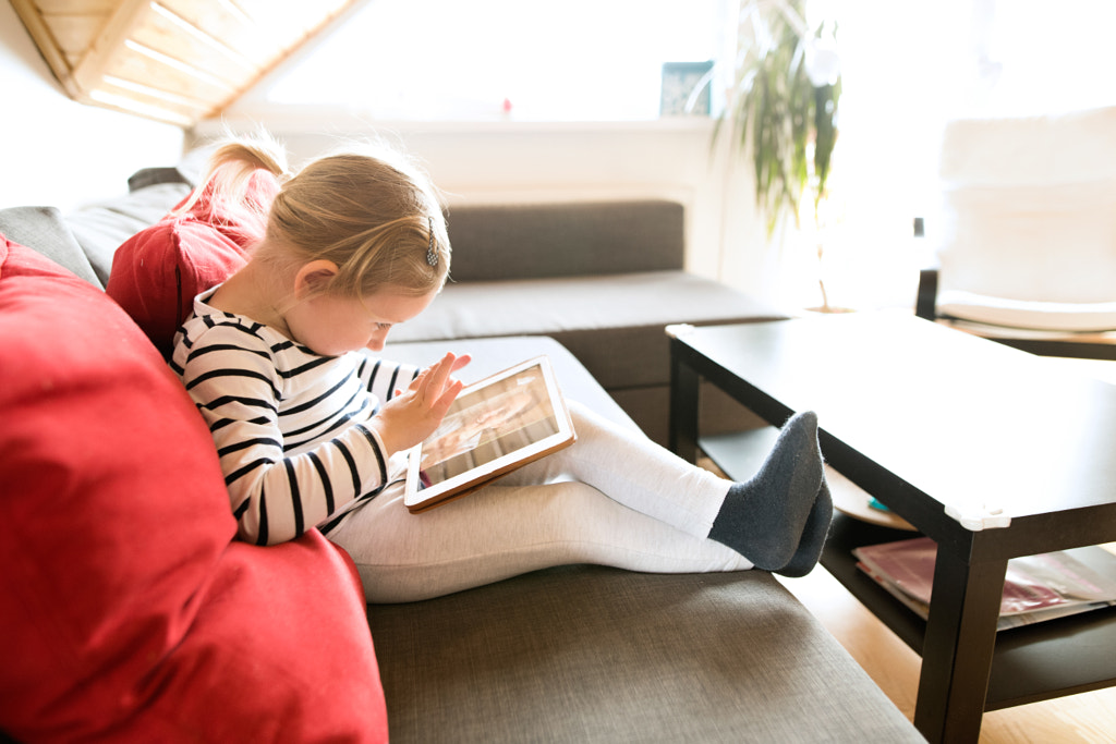 Little girl at home with tablet, video chatting with her mother. by Jozef Polc on 500px.com