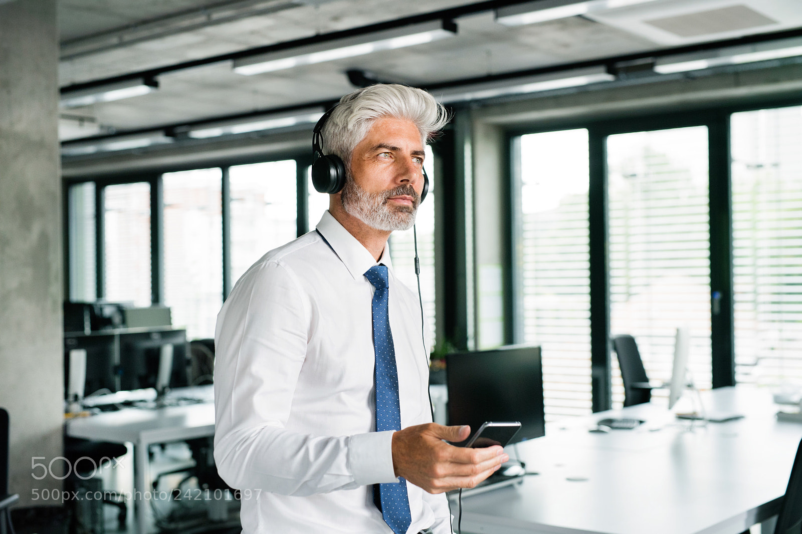 Nikon D5 sample photo. Mature businessman with headphones photography