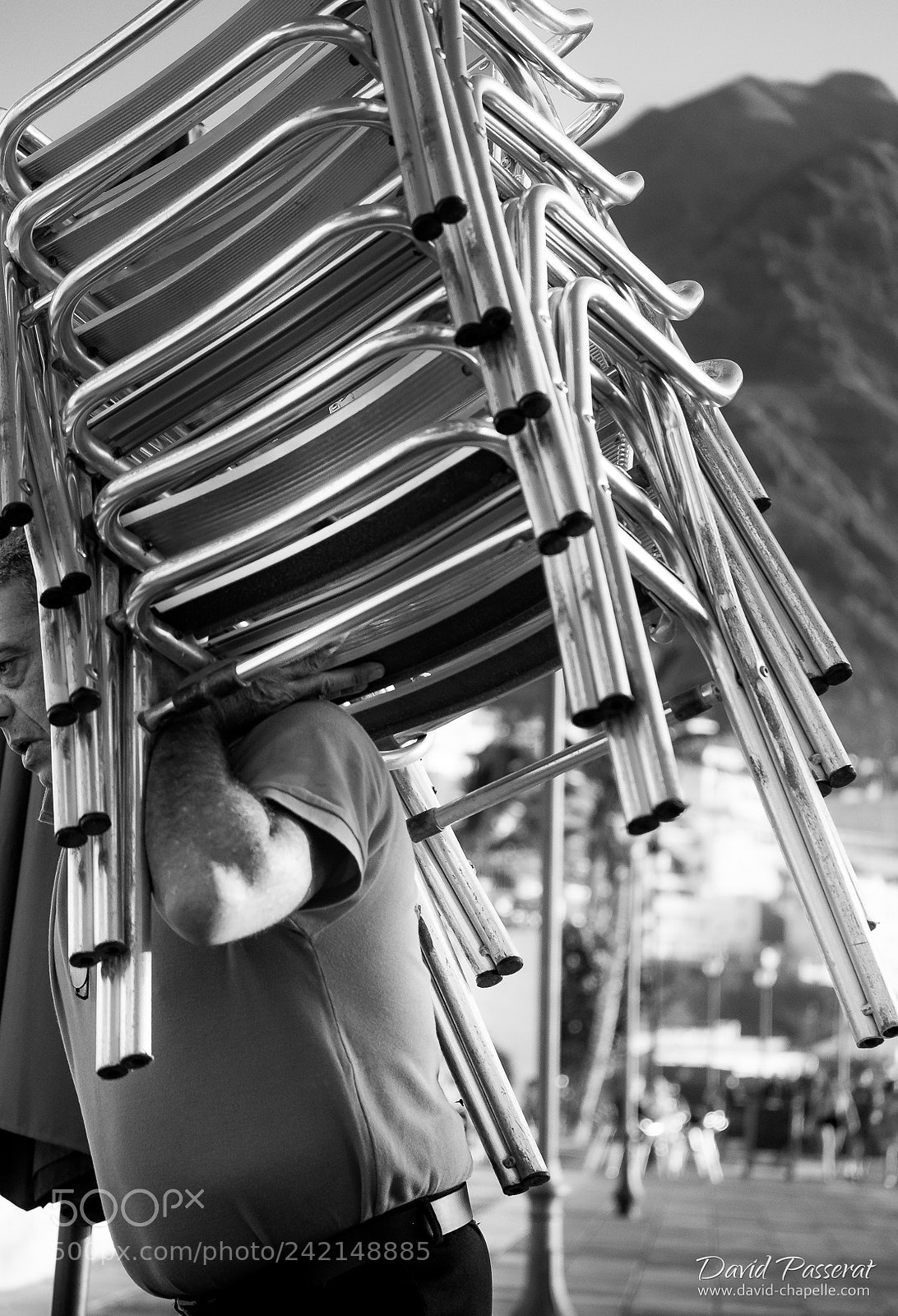 Fujifilm X-E1 sample photo. Stacked chairs in puerto photography
