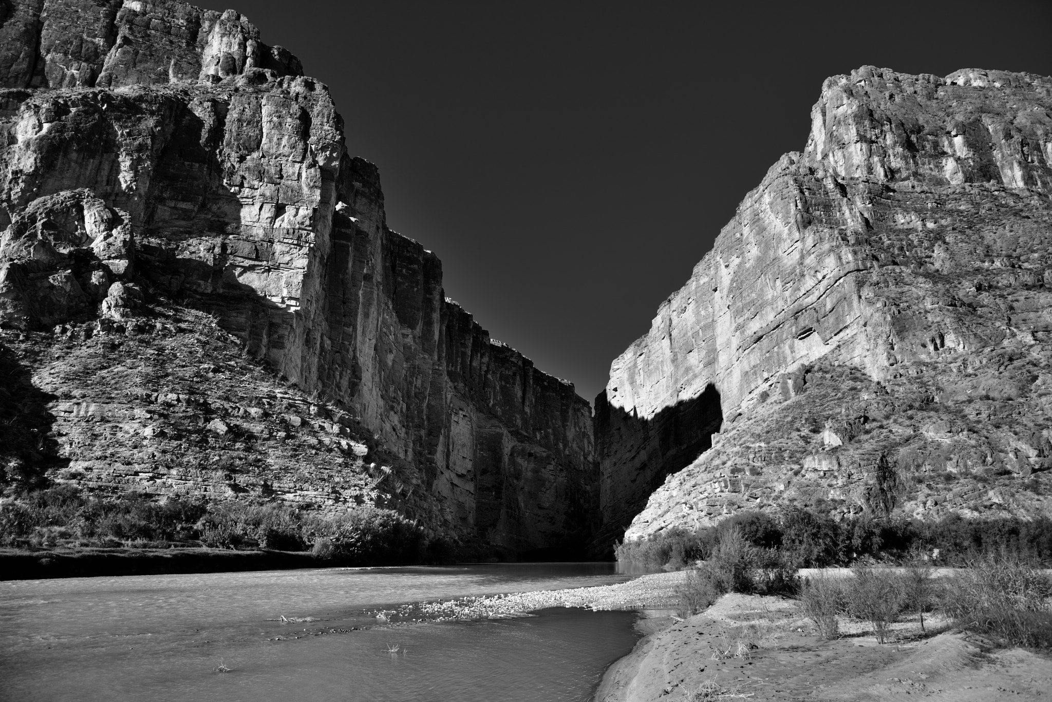 Nikon D800E + Nikon AF-S Nikkor 24-120mm F4G ED VR sample photo. A canyon and river to separate two countries and create a border (black & white) photography