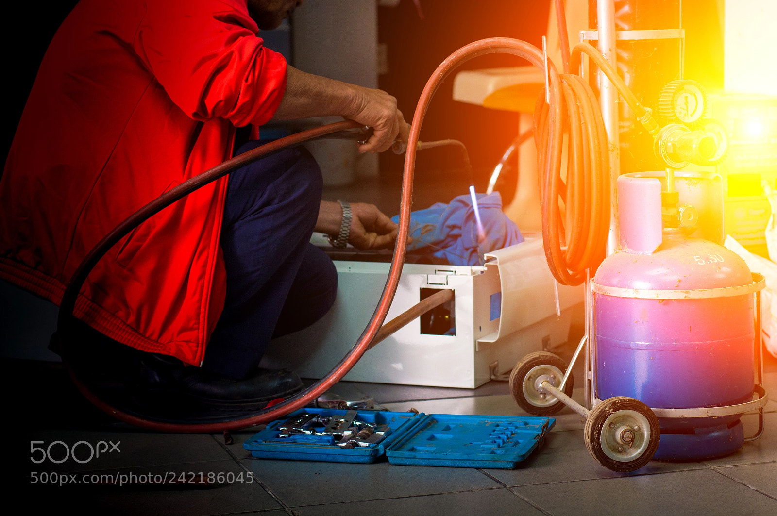 Canon EOS 60D sample photo. Repairman soldering copper pipe photography