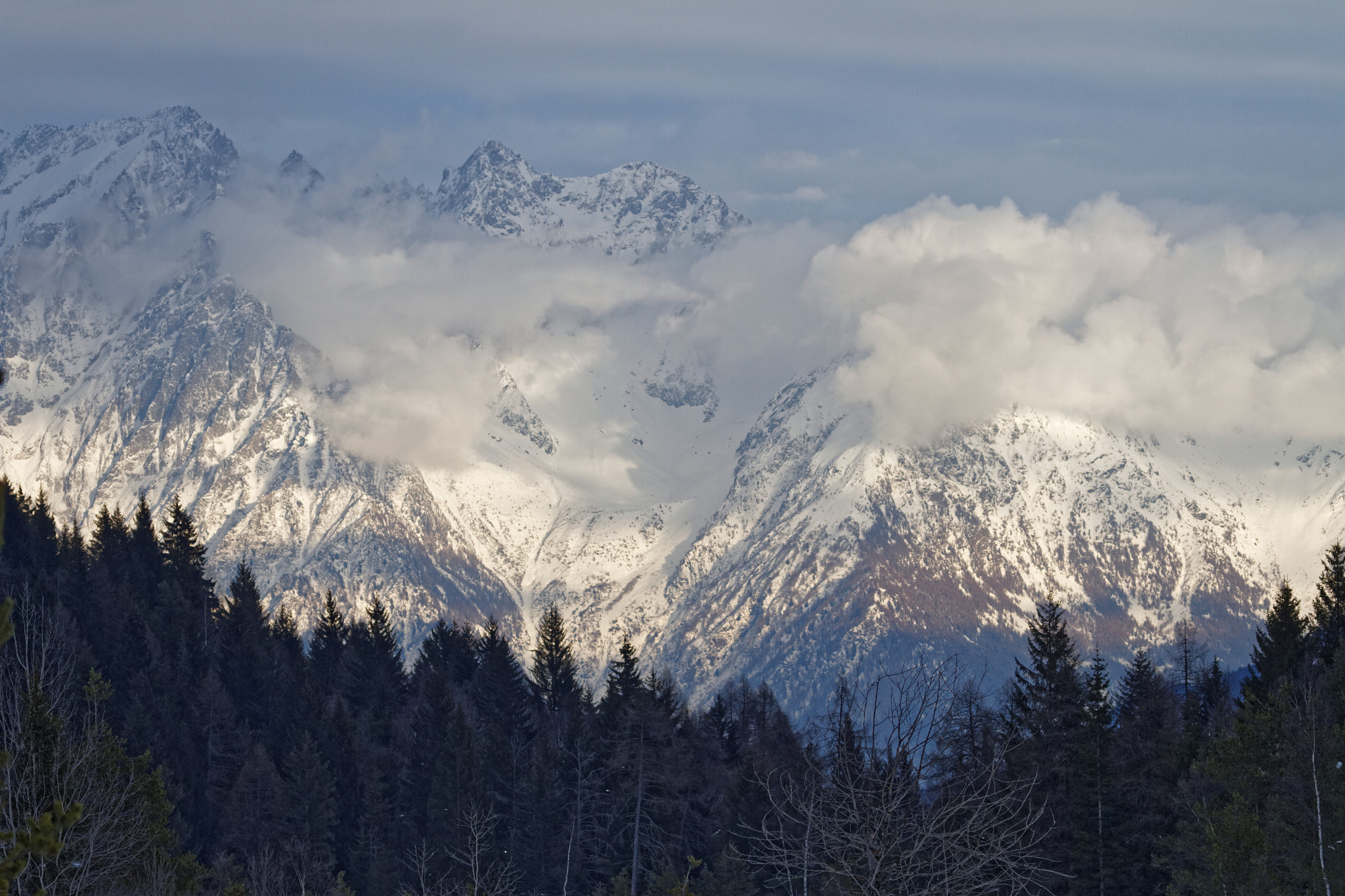 Canon EOS 7D + Canon EF 100-400mm F4.5-5.6L IS USM sample photo. Mountains in the clouds photography