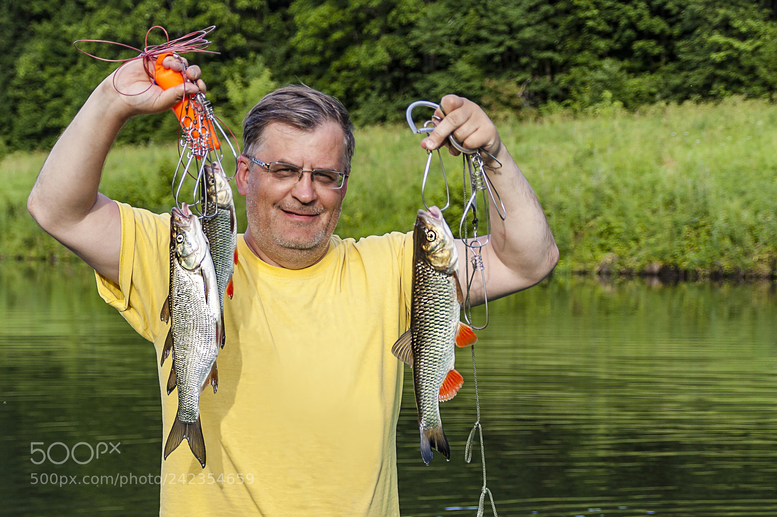 Canon EOS 50D sample photo. Lucky fisherman keeps fish photography
