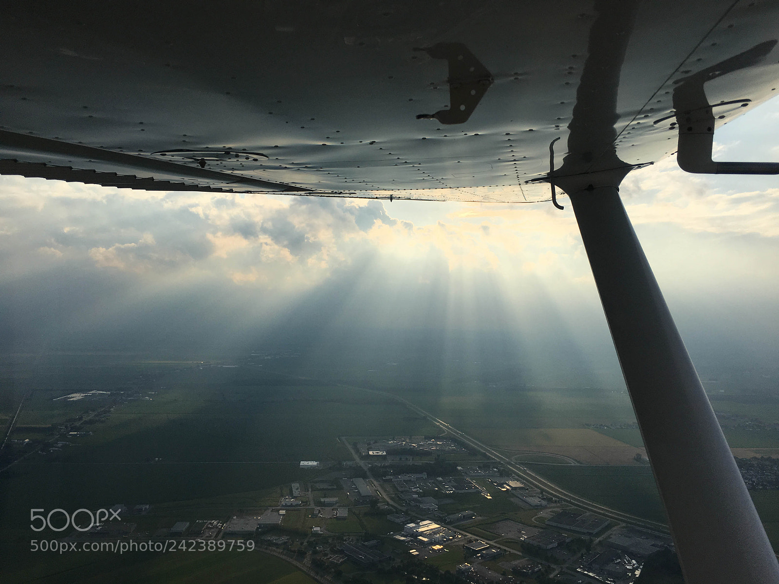 Apple iPhone 6s sample photo. Setting sun in flight photography