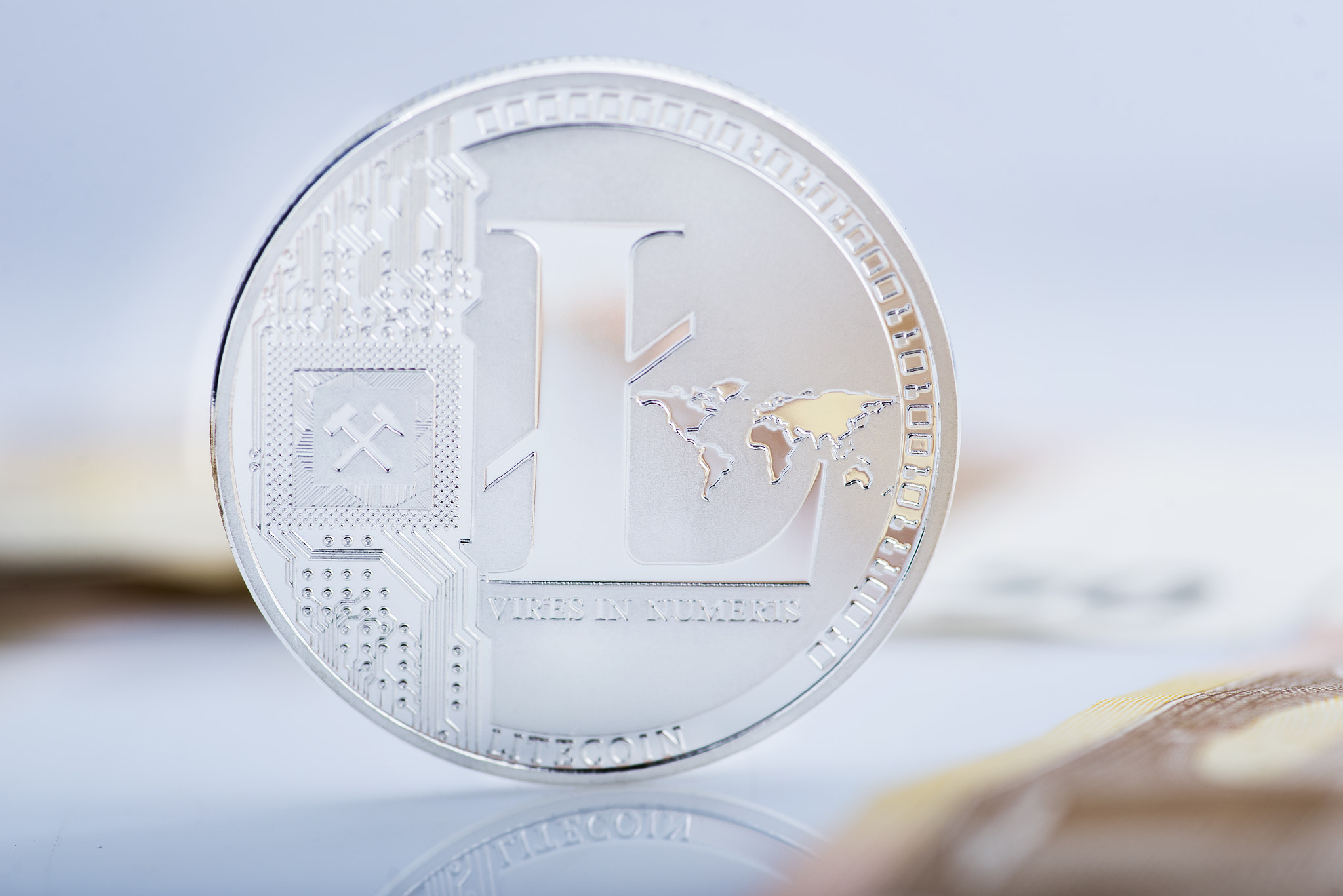 Litecoin on blurry background with selective focus