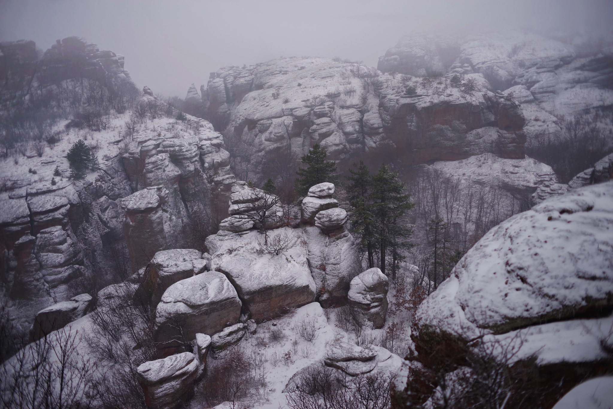 Pentax smc DA 50mm F1.8 sample photo. Snowy rocks photography