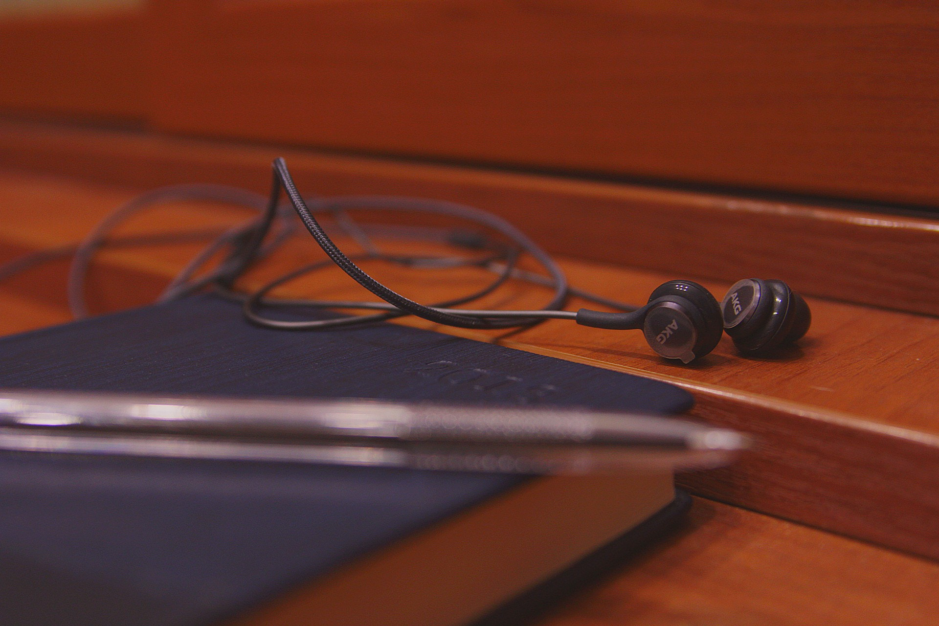 Canon EOS 60D sample photo. Pencil notebook headphones photography