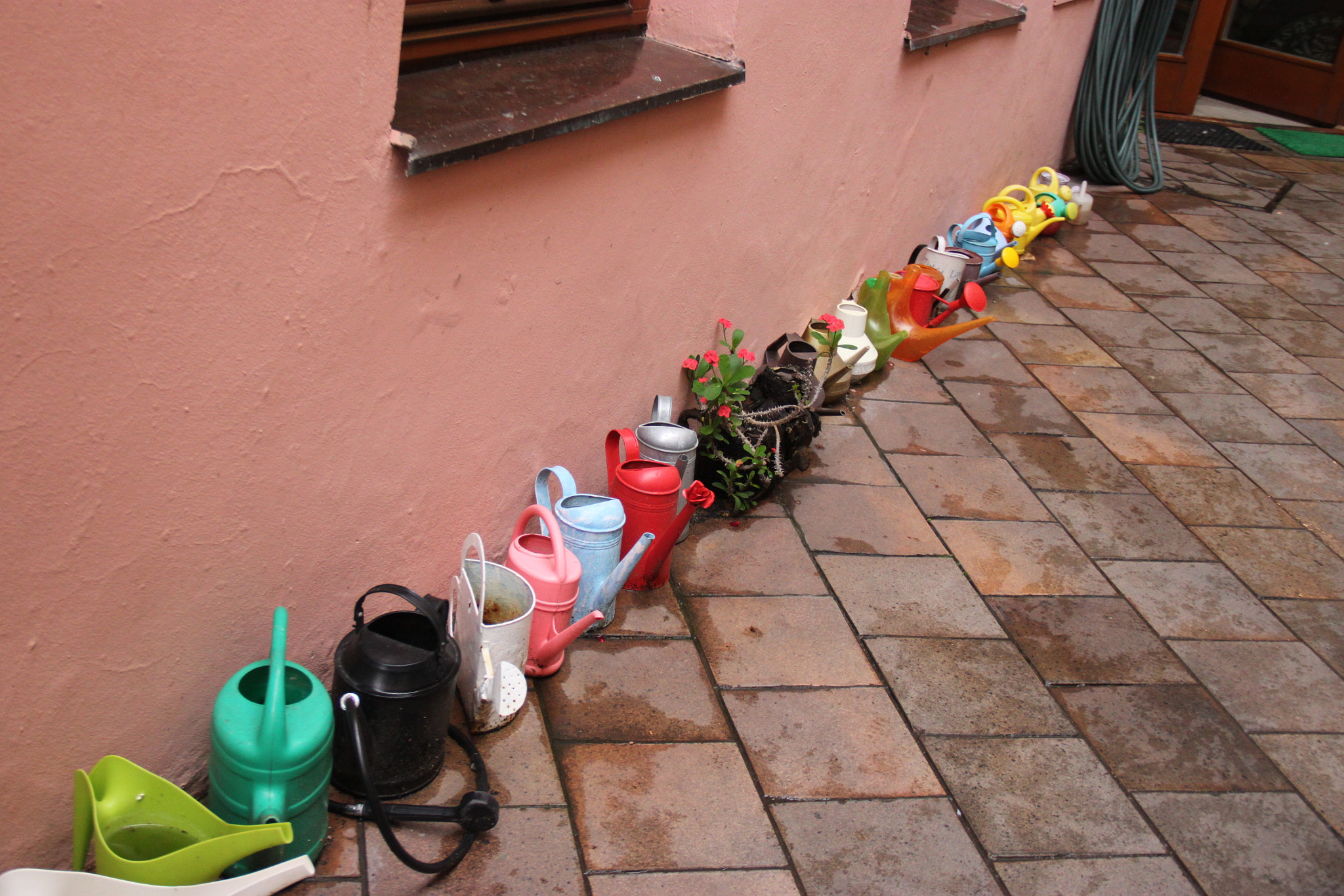 Canon EF-S 18-135mm F3.5-5.6 IS sample photo. Set of watering pots on street photography