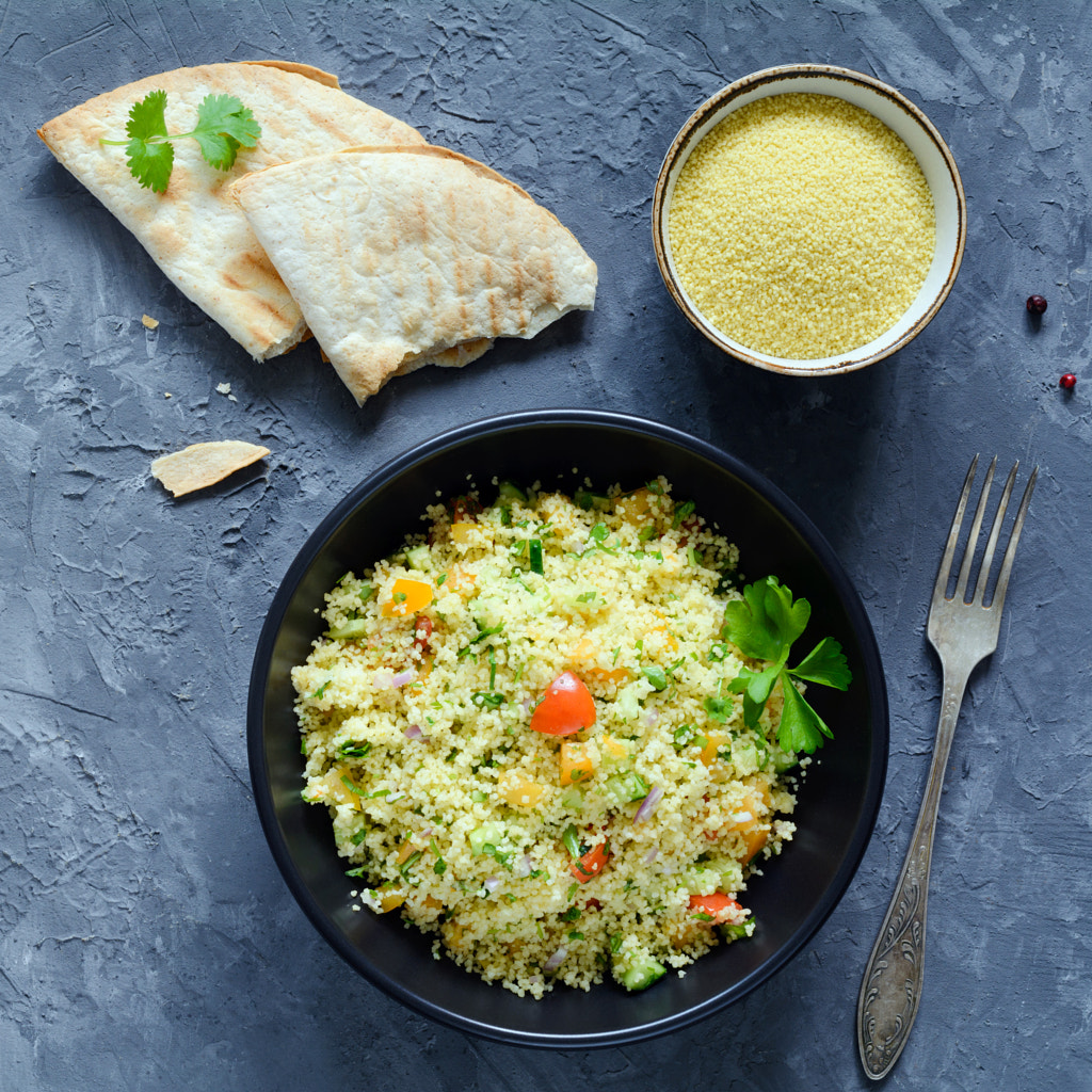 Lebanese cous cous salad Tabbouleh with vegetables and greens by Vladislav Nosick on 500px.com