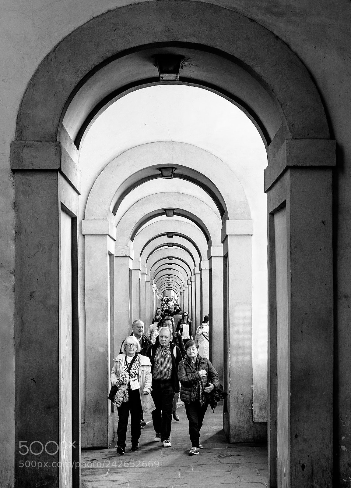Fujifilm X-T1 sample photo. Walking under the arches photography