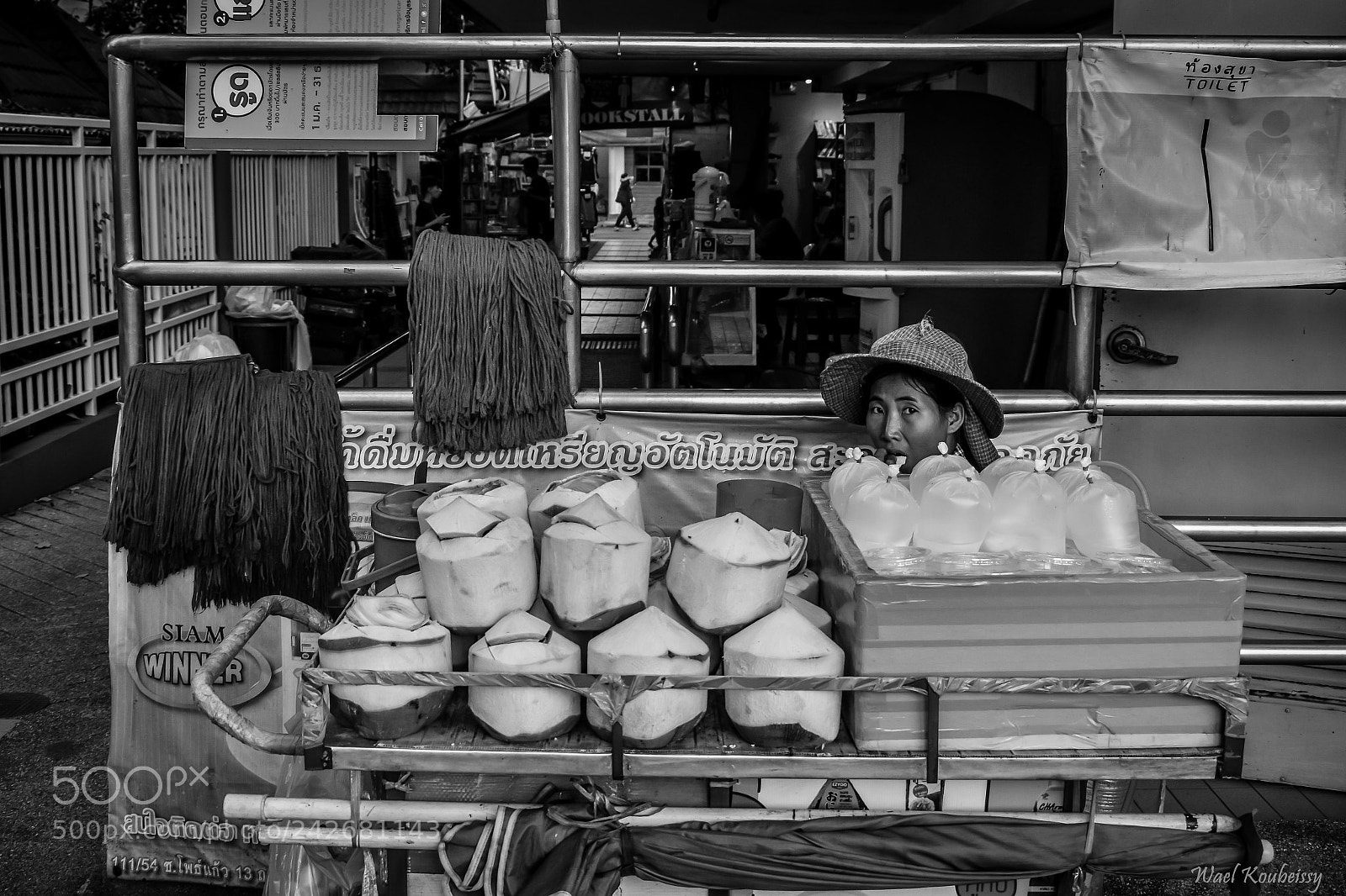 Nikon D5500 sample photo. The coconut seller photography