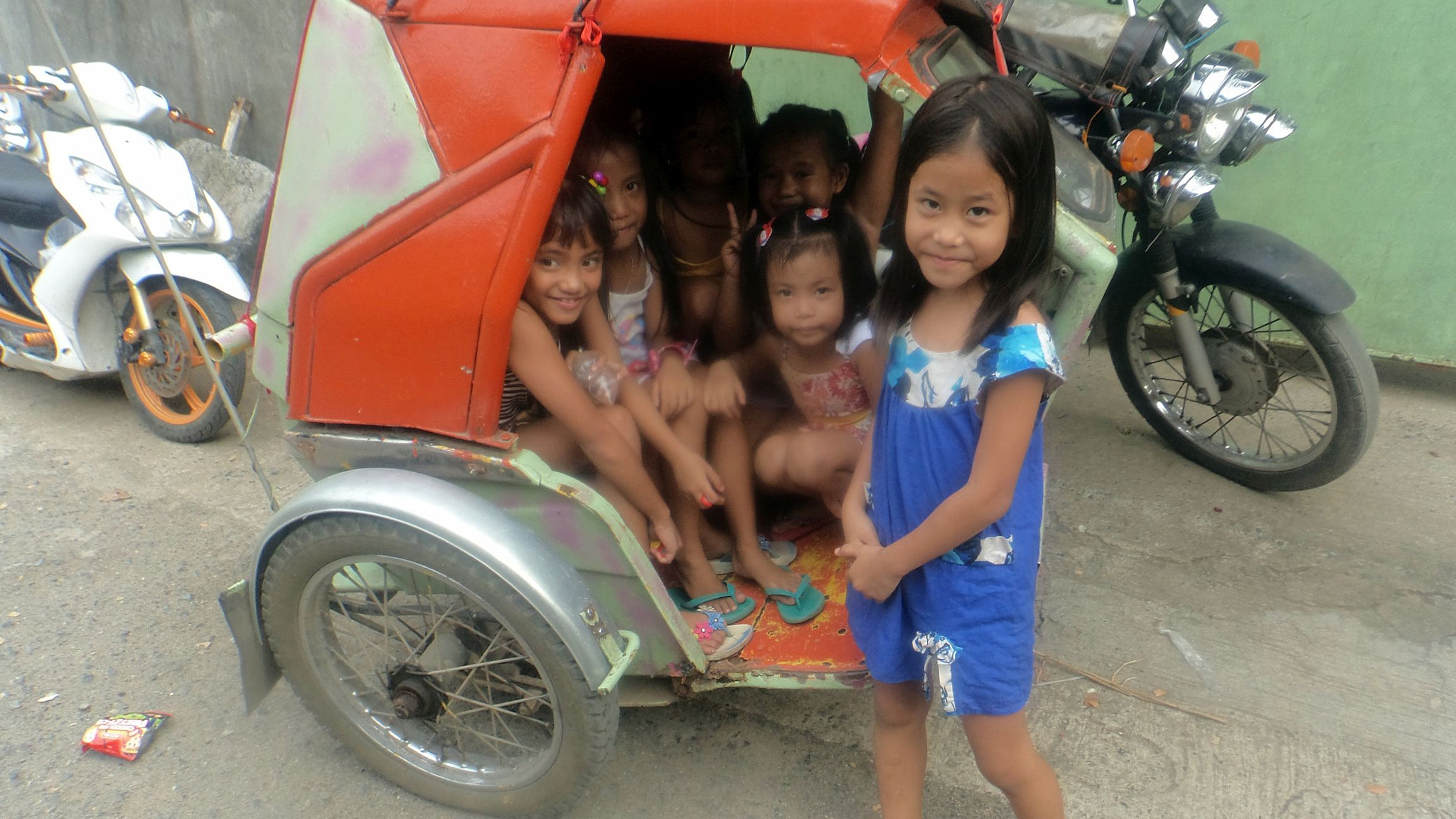 Sony Cyber-shot DSC-TF1 sample photo. Girls in a trike photography