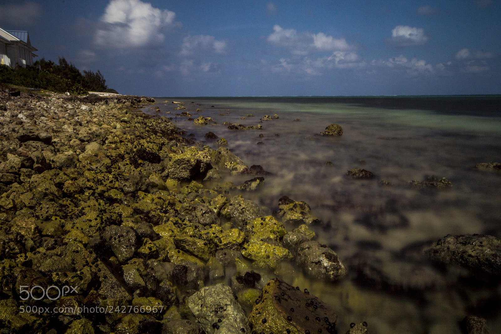 Canon EOS 600D (Rebel EOS T3i / EOS Kiss X5) sample photo. Cayman slow beach rocky photography