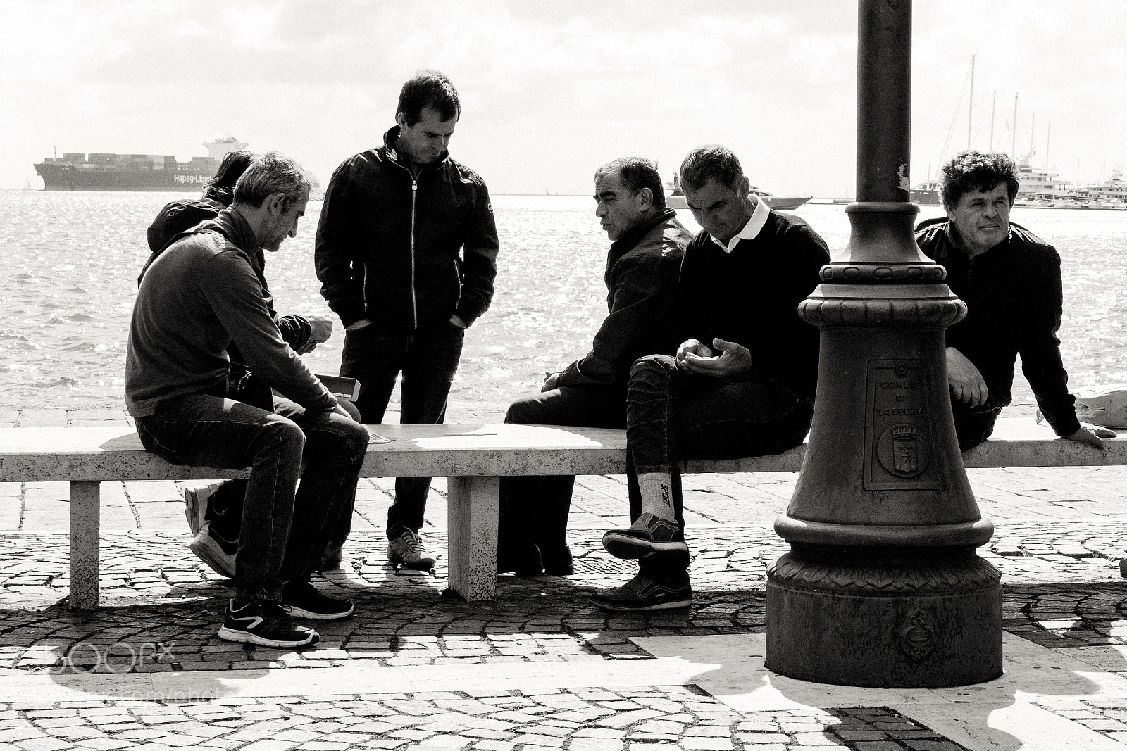 Sony a6500 sample photo. Men on bench by photography