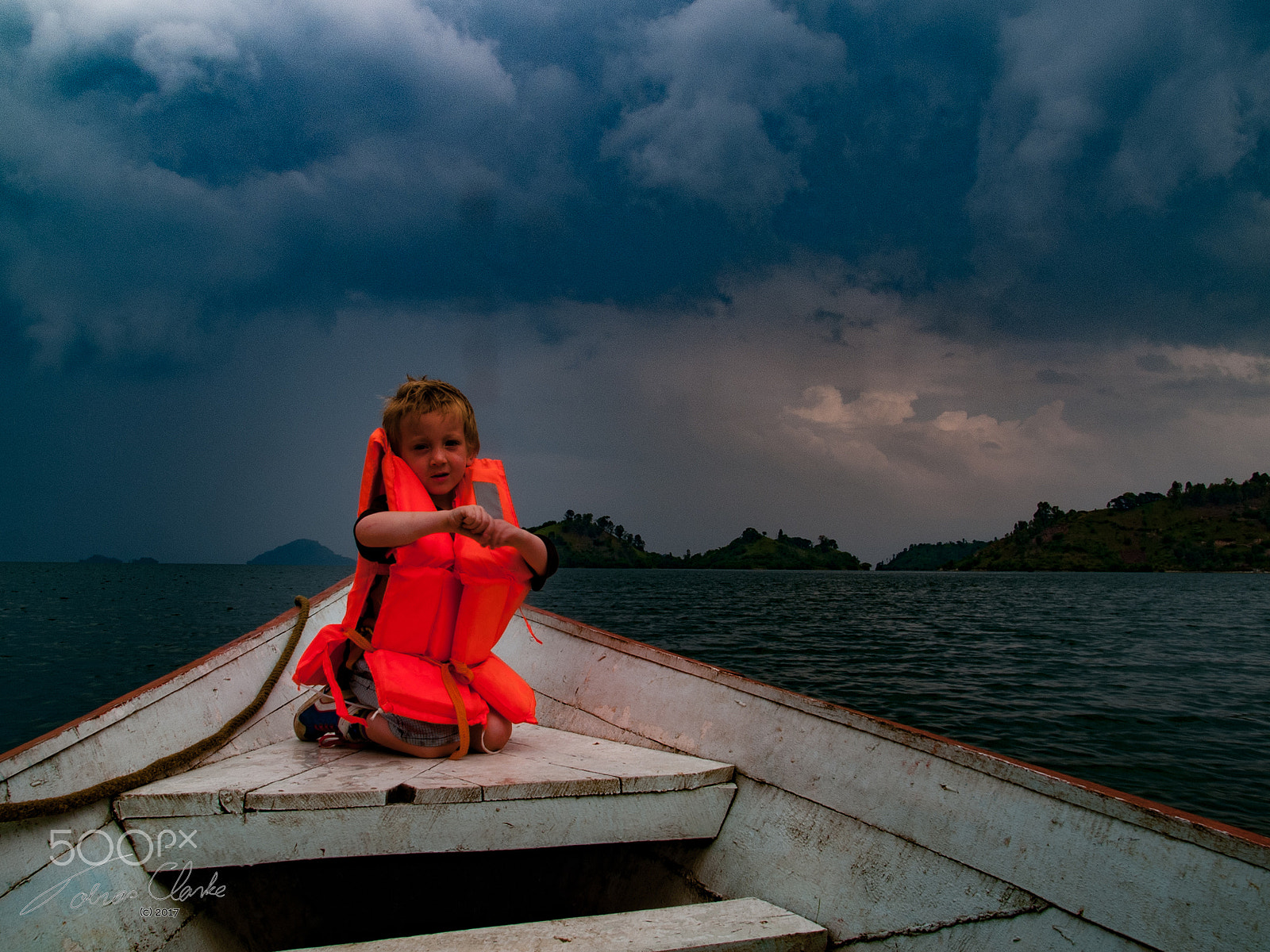 Olympus E-1 sample photo. Boy in a boat photography