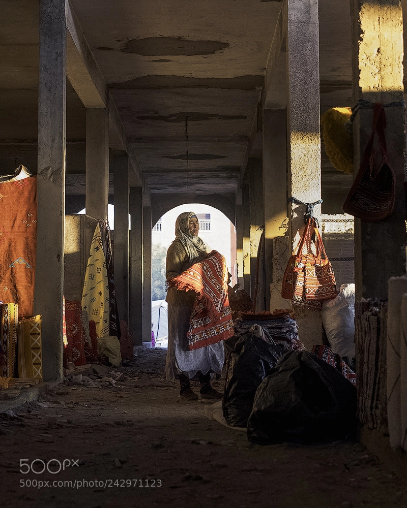 Fujifilm X-T2 sample photo. Woman in rug market photography