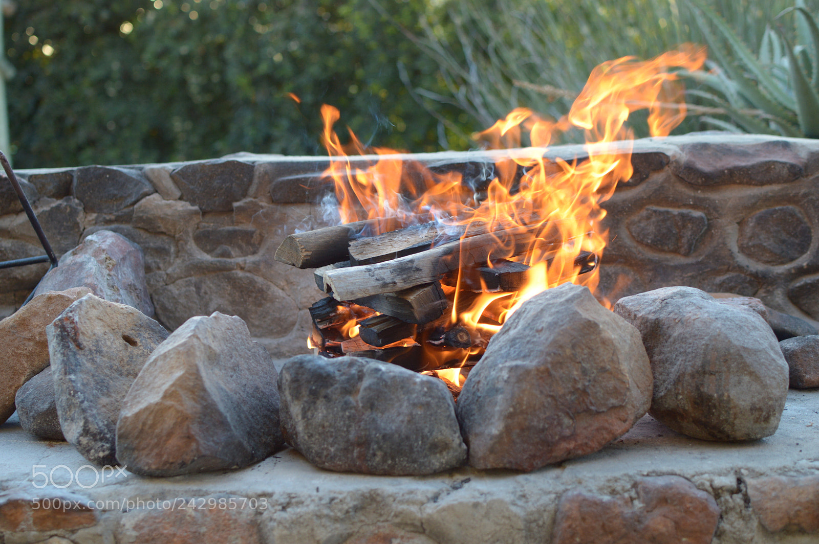Nikon D3200 + Nikon AF-S DX Nikkor 35mm F1.8G sample photo. Rustic log fire photography