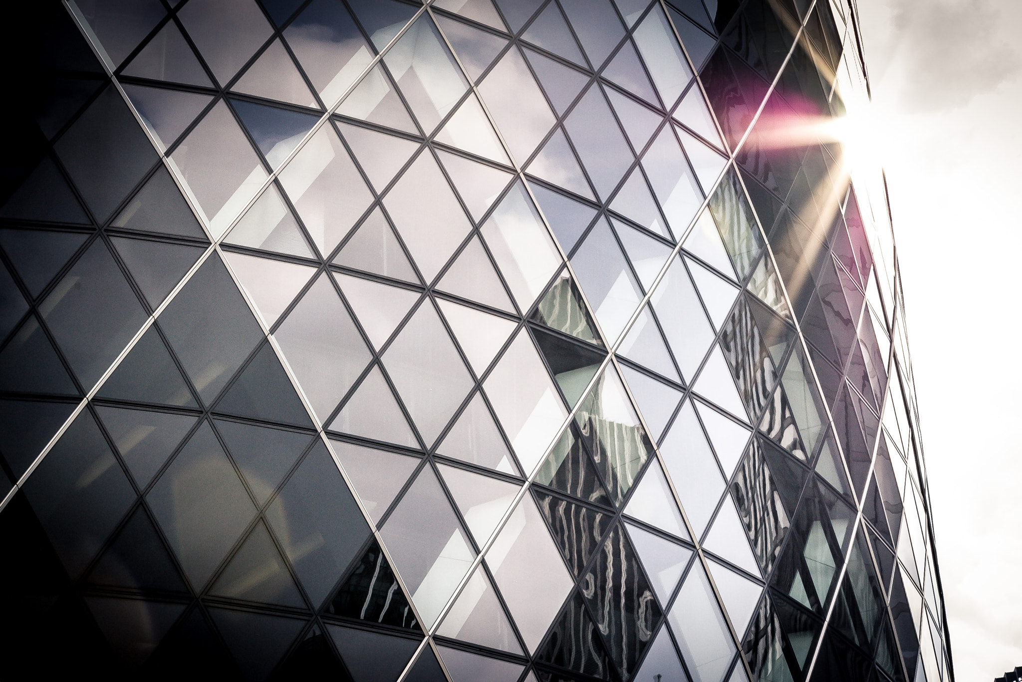 Pentax K100D sample photo. Sunflare at the gherkin photography