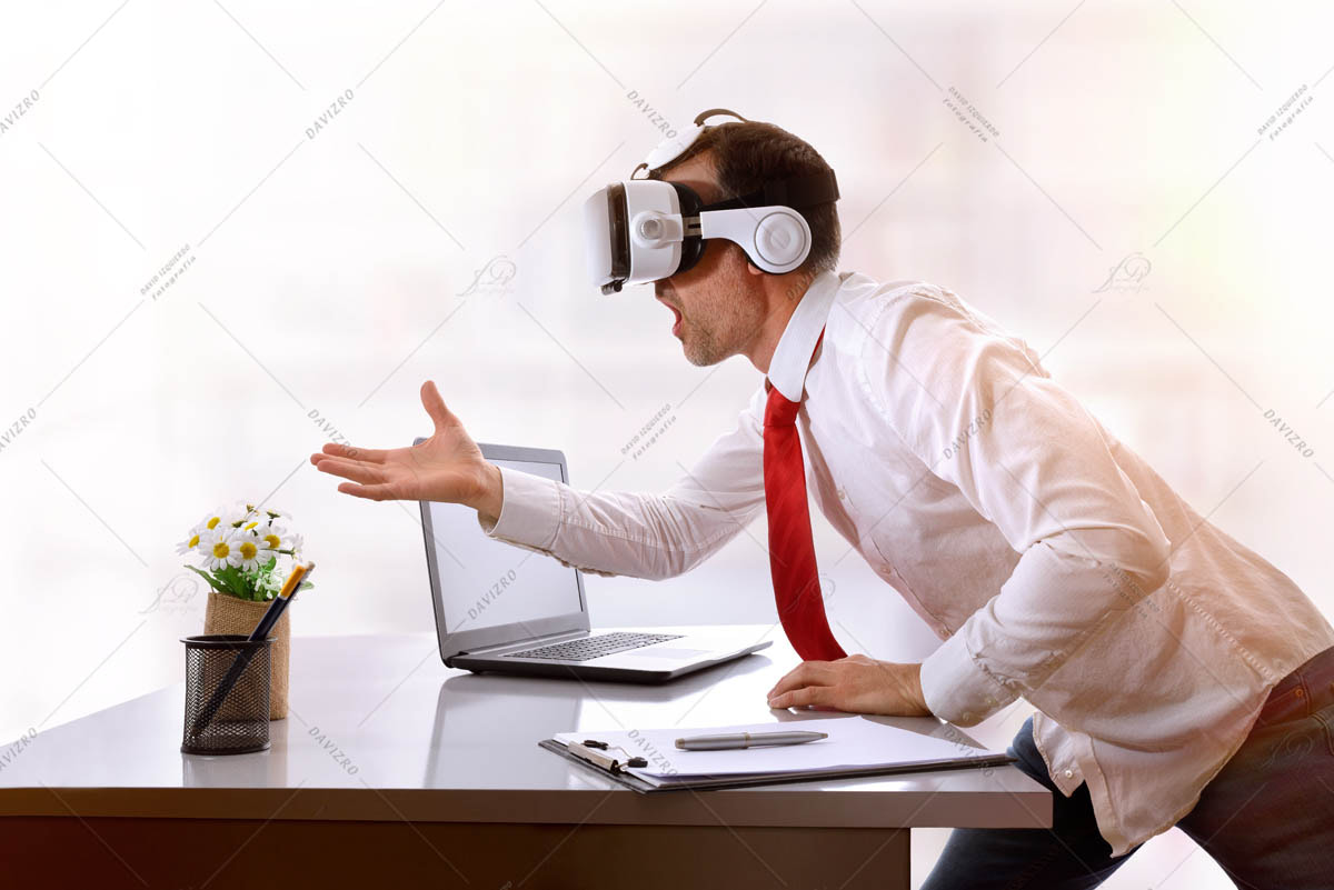 Very surprised businessman using virtual reality glasses on his