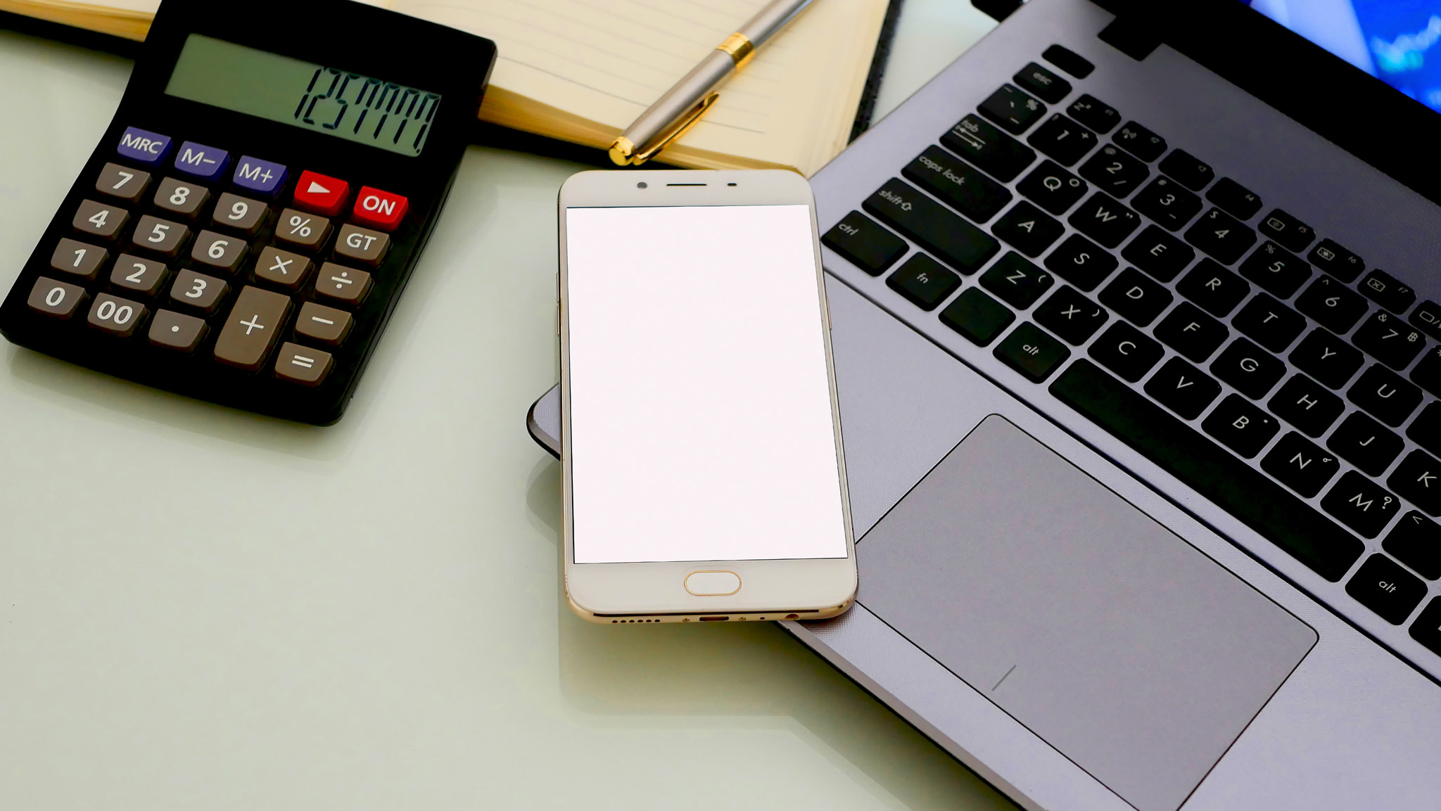 Business man using a mobile phone device with stock graph