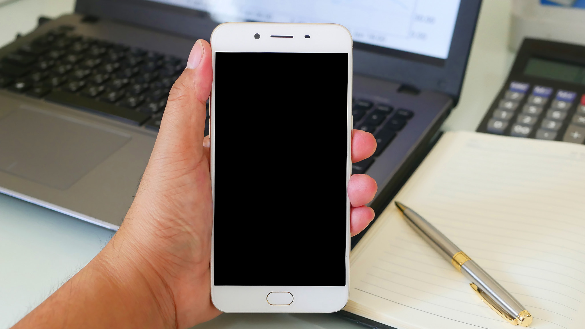 Business man using a mobile phone device with stock graph,checki