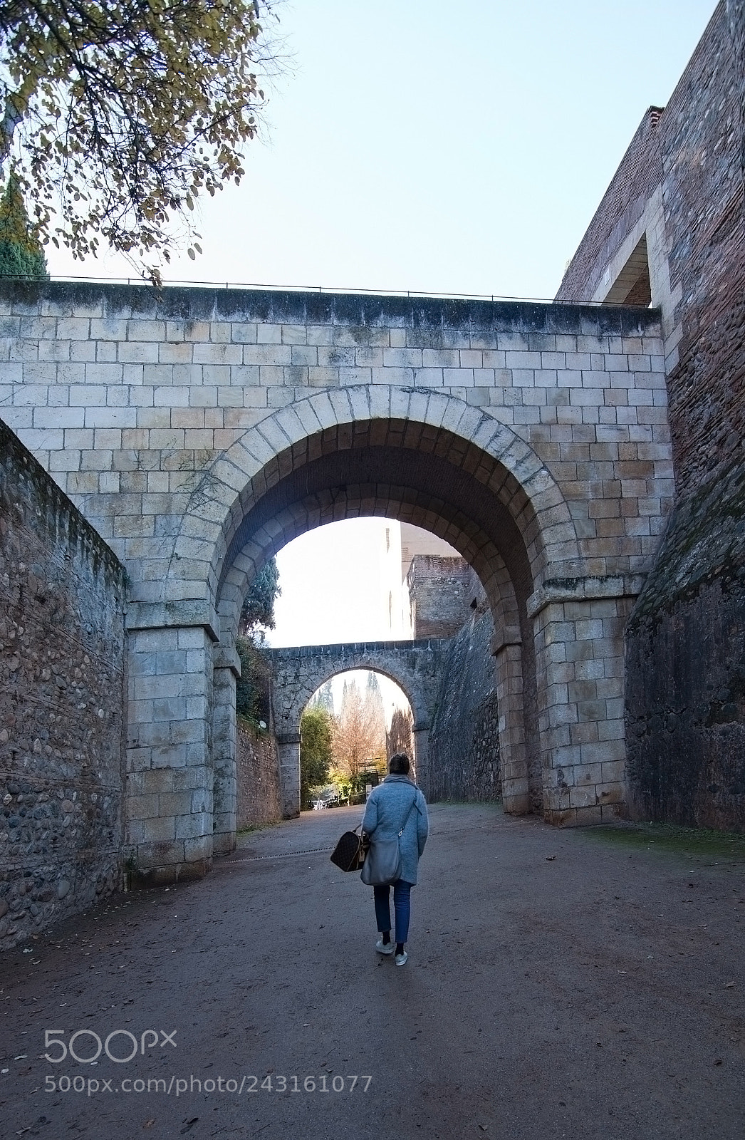 Nikon D7100 sample photo. Woman walks through vaults photography
