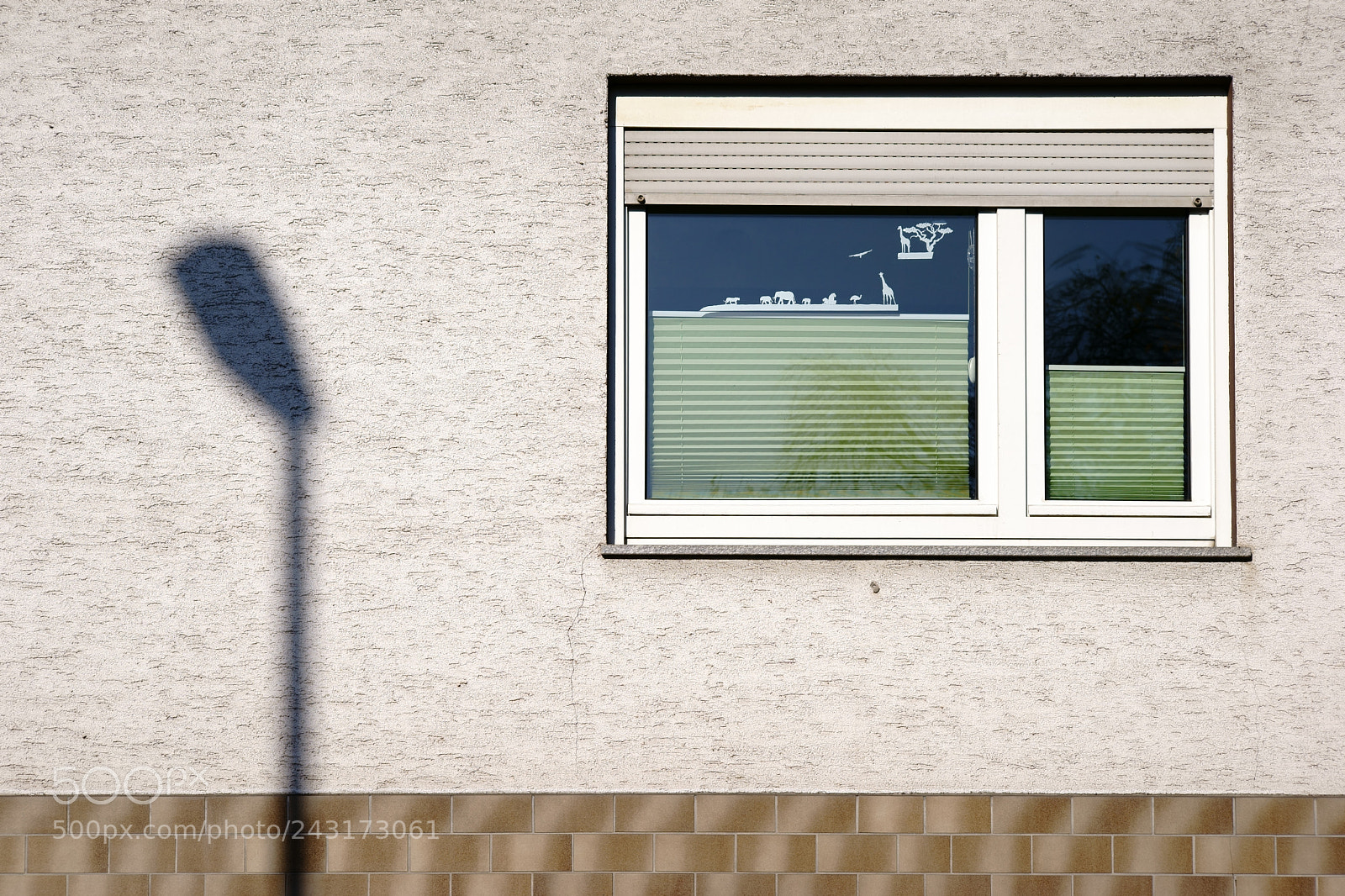Sony a7 II sample photo. Lantern shadow on facade photography