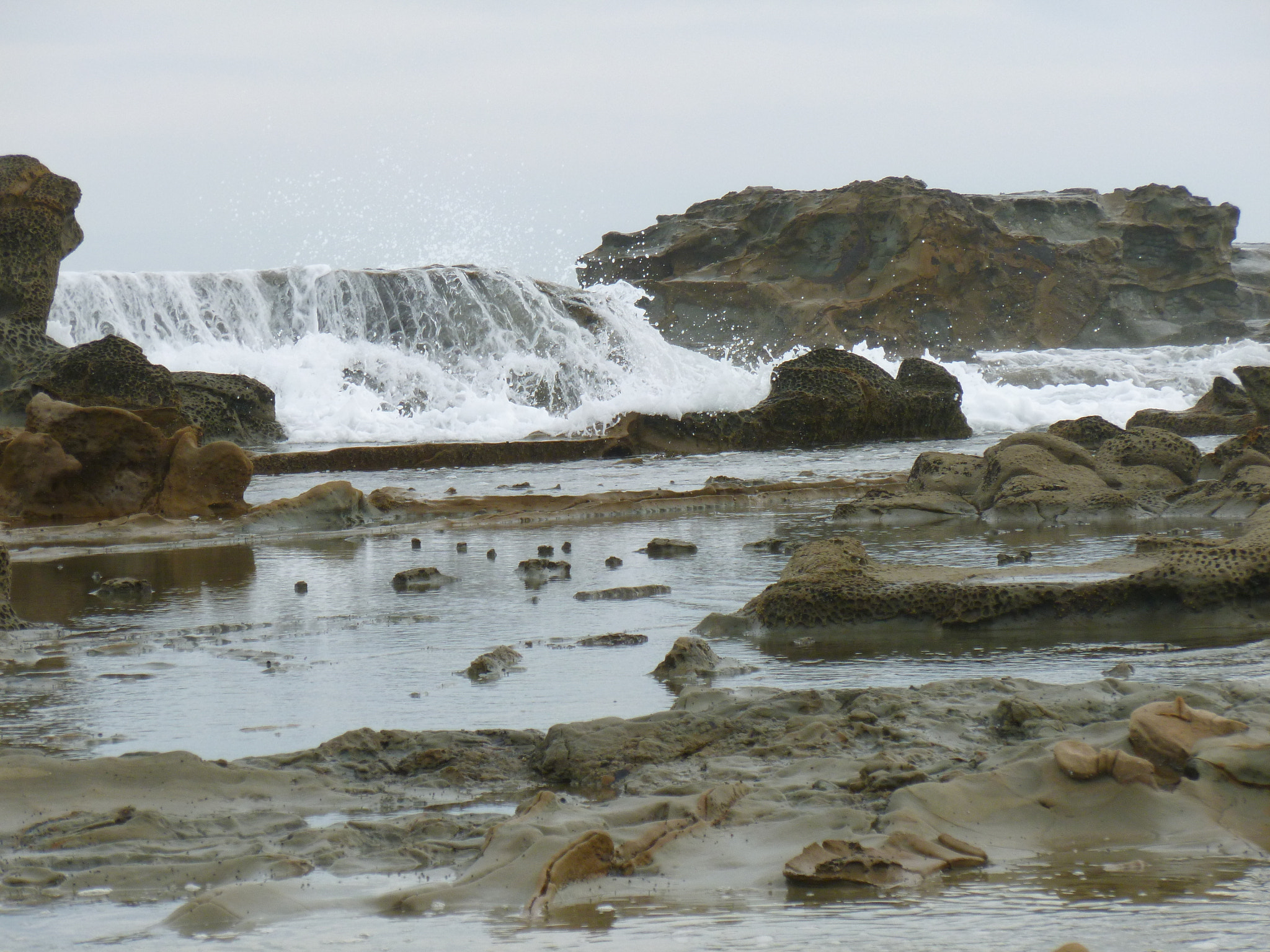 Panasonic DMC-FH25 sample photo. Cascading waves at kilcunda beach photography
