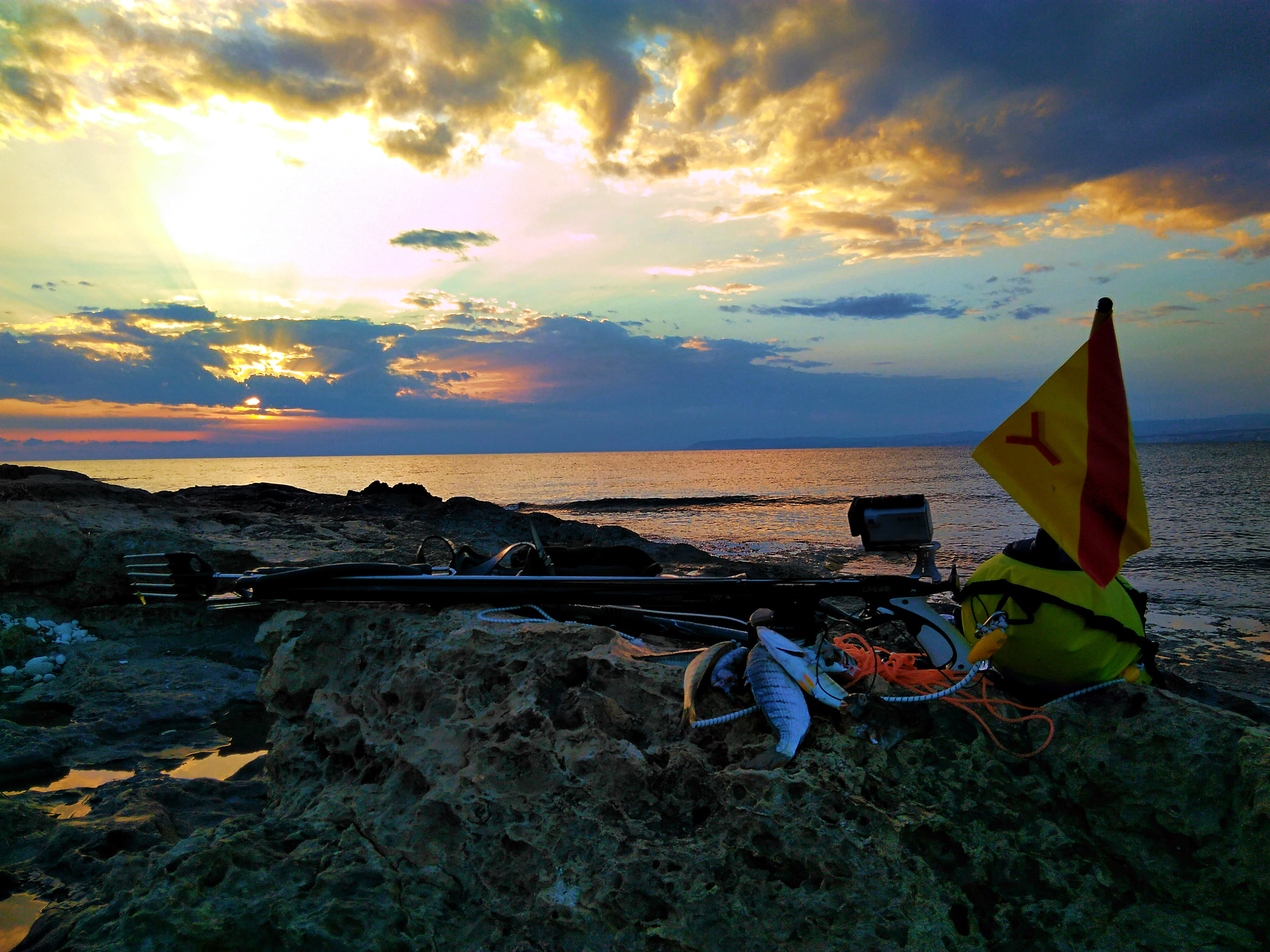 QCOM-AA QCAM-AA sample photo. Spearfishing sunset photography