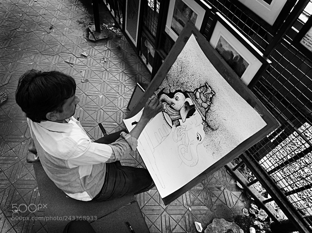 Olympus OM-D E-M5 II sample photo. Road side artist photography
