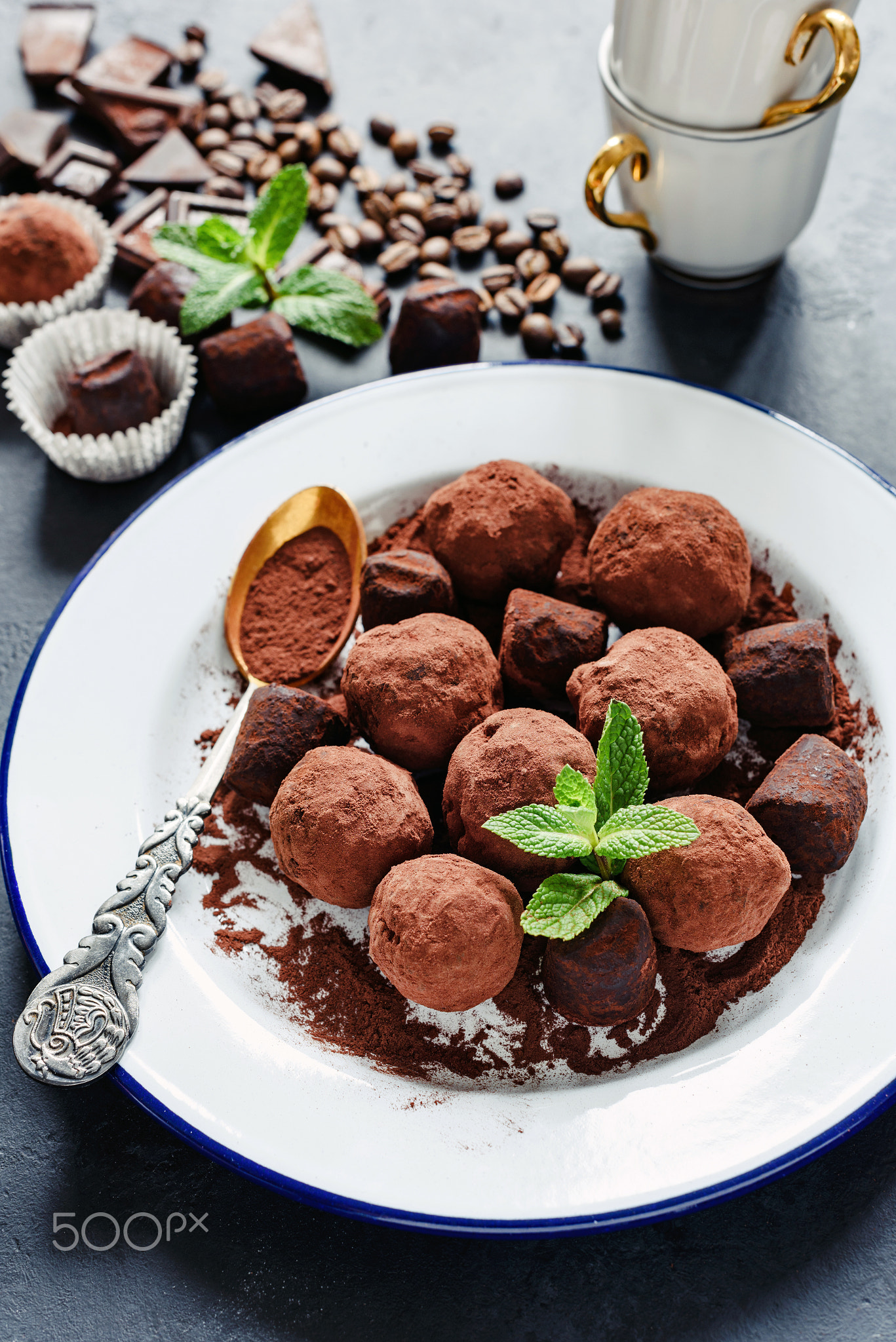 Chocolate truffes decorated with mint and cocoa